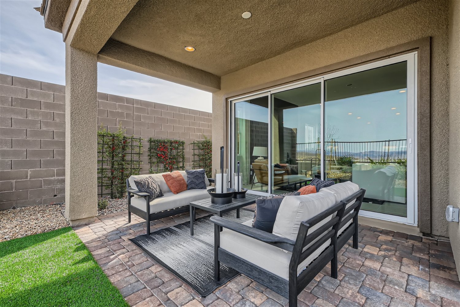 A living room with a large glass door.
