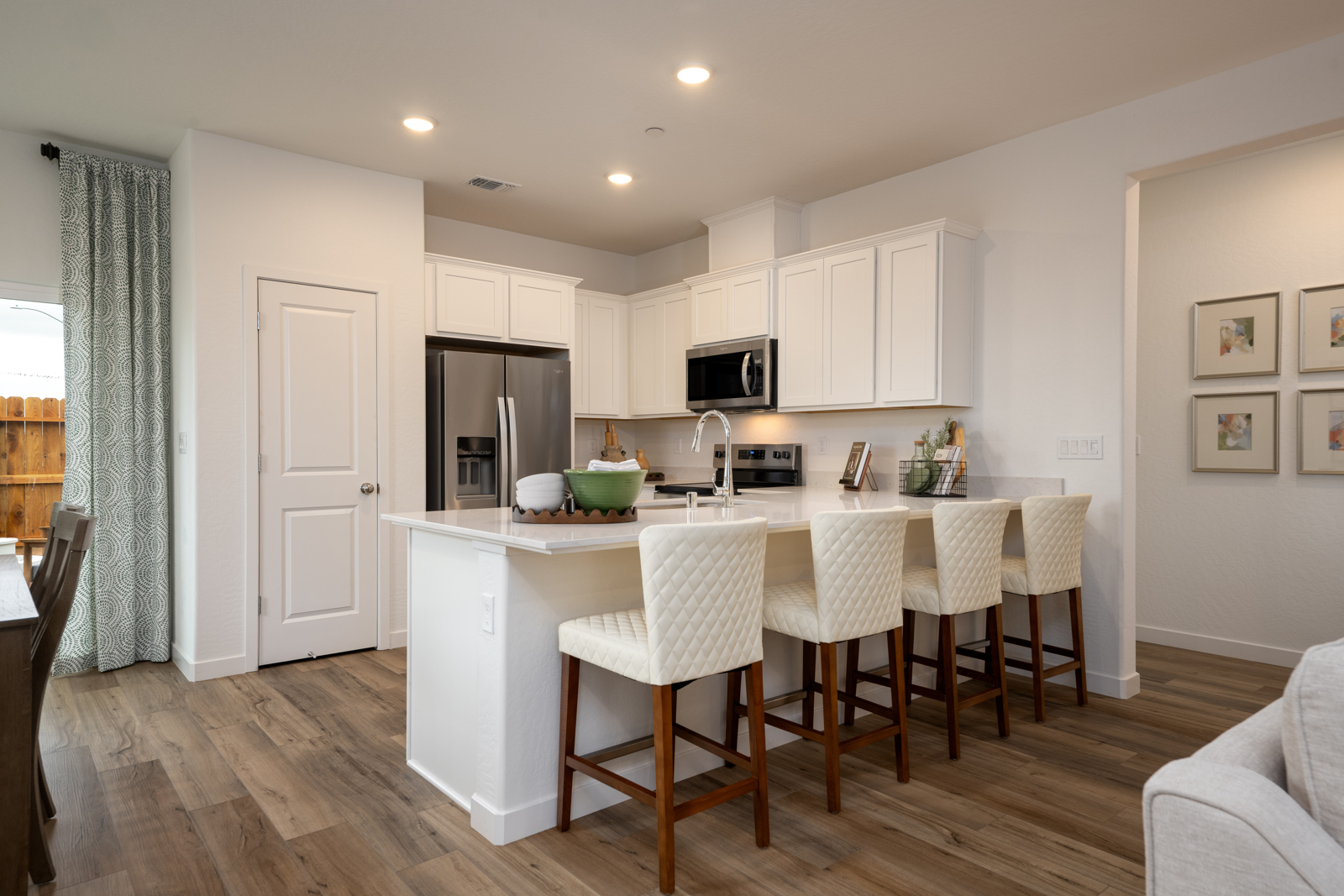 A kitchen with a dining table.