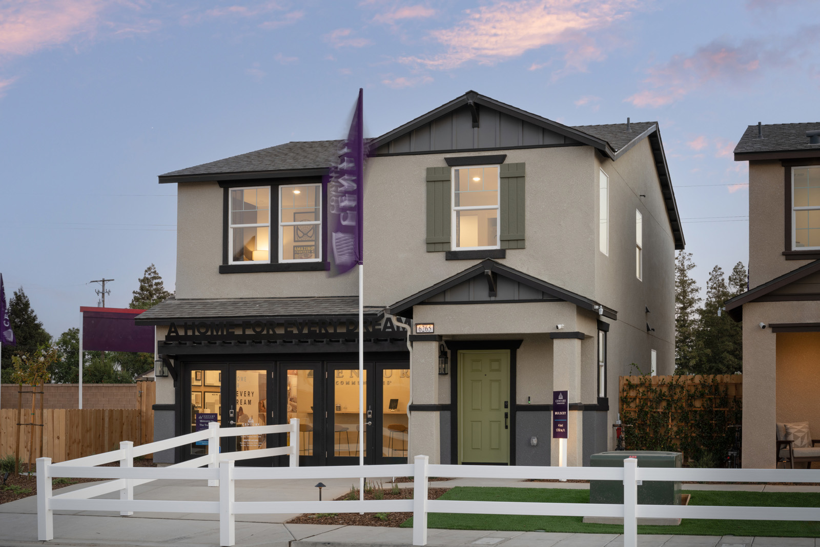 A house with a white picket fence.