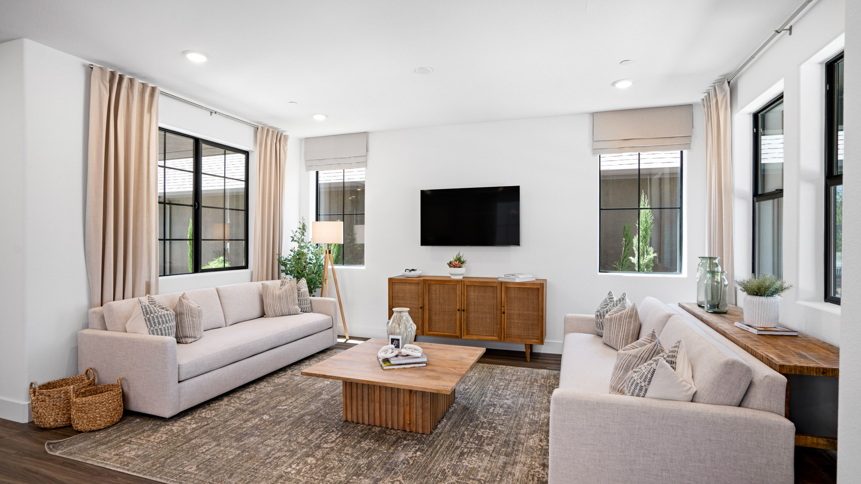 A living room with a tv and couches.