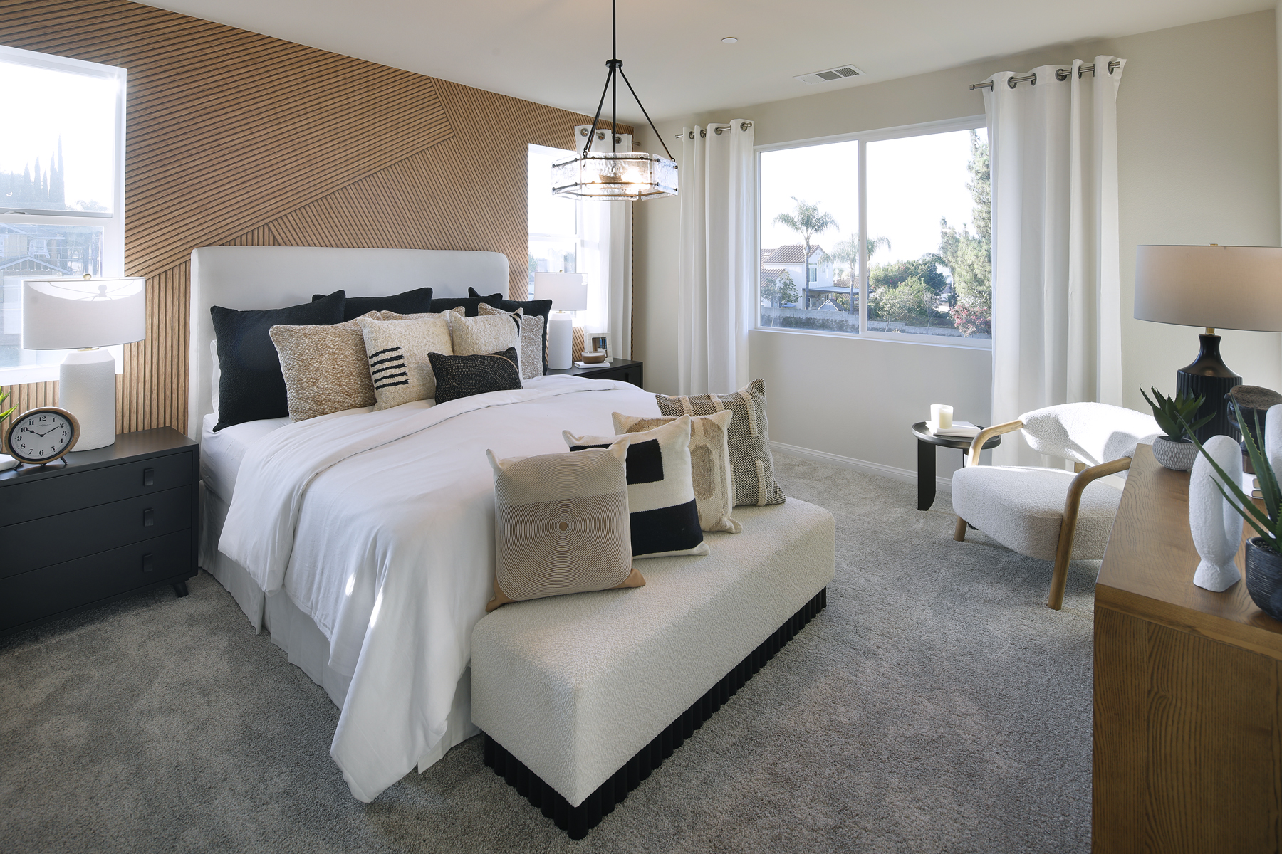 A bedroom with a bed and a couch.