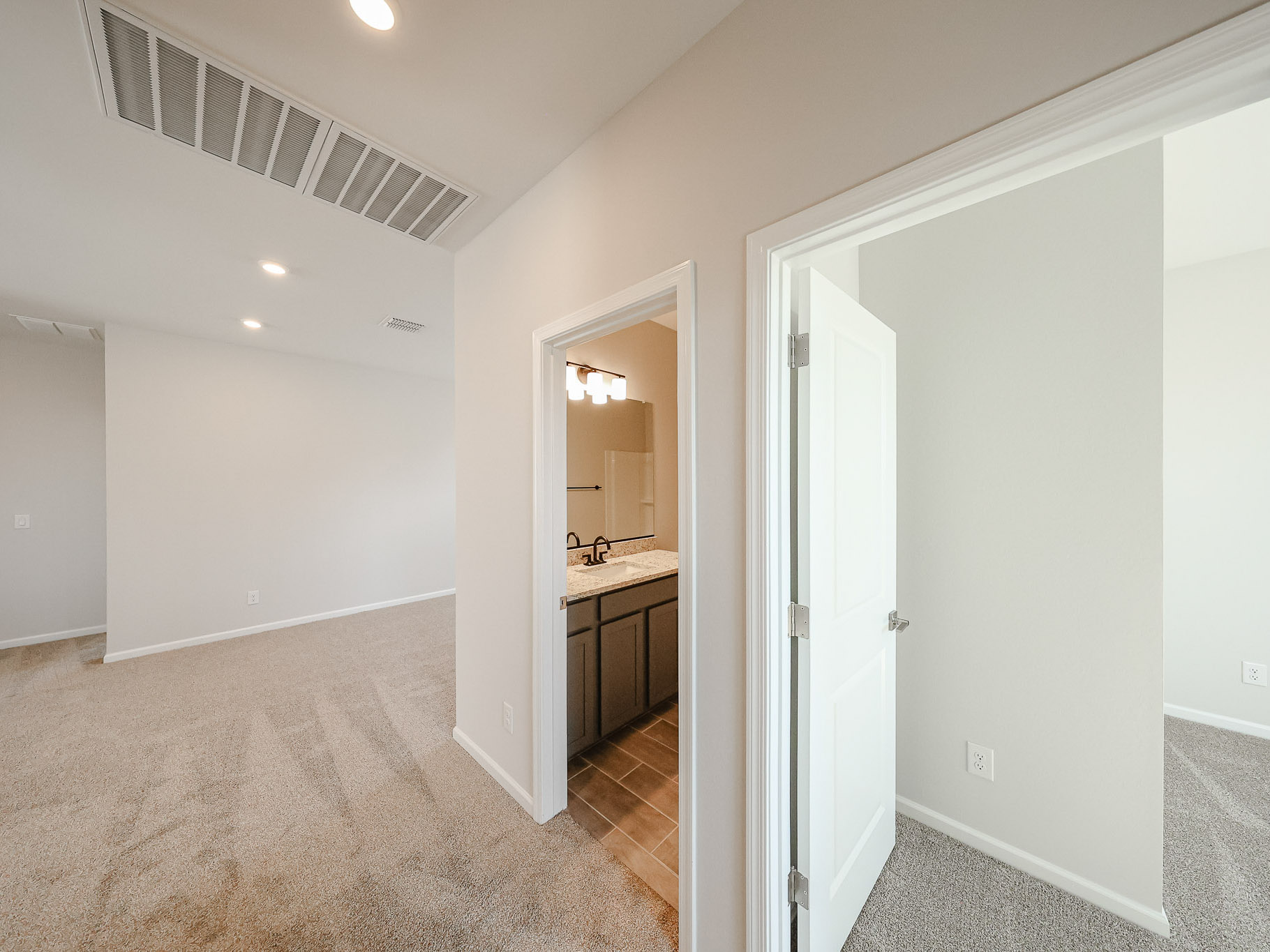 A bathroom with a sink and a mirror.