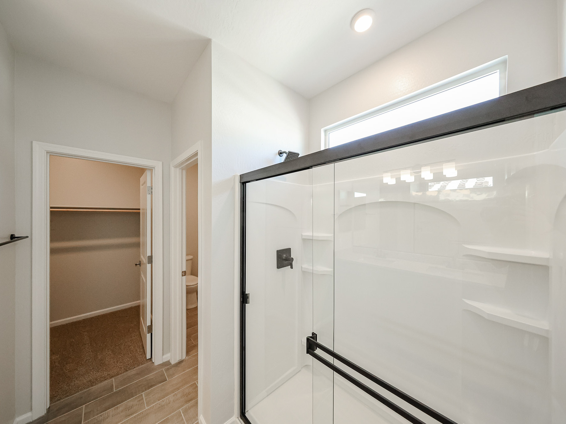 A bathroom with a glass shower.