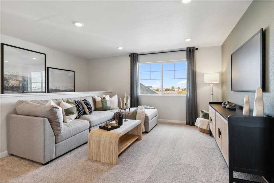 A living room with a large window.