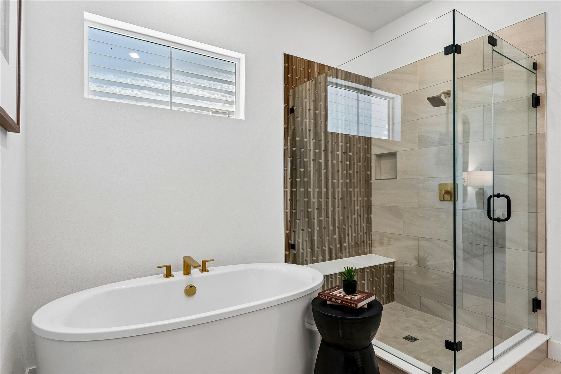 A bathroom with a glass shower.