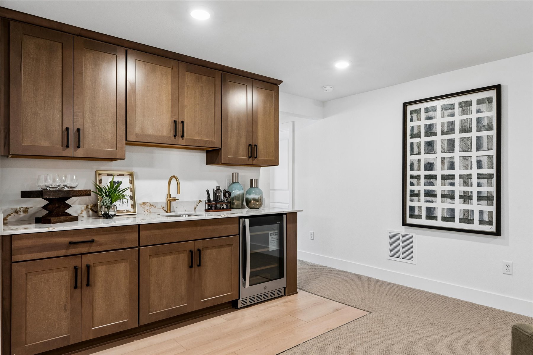 A kitchen with wooden cabinets.
