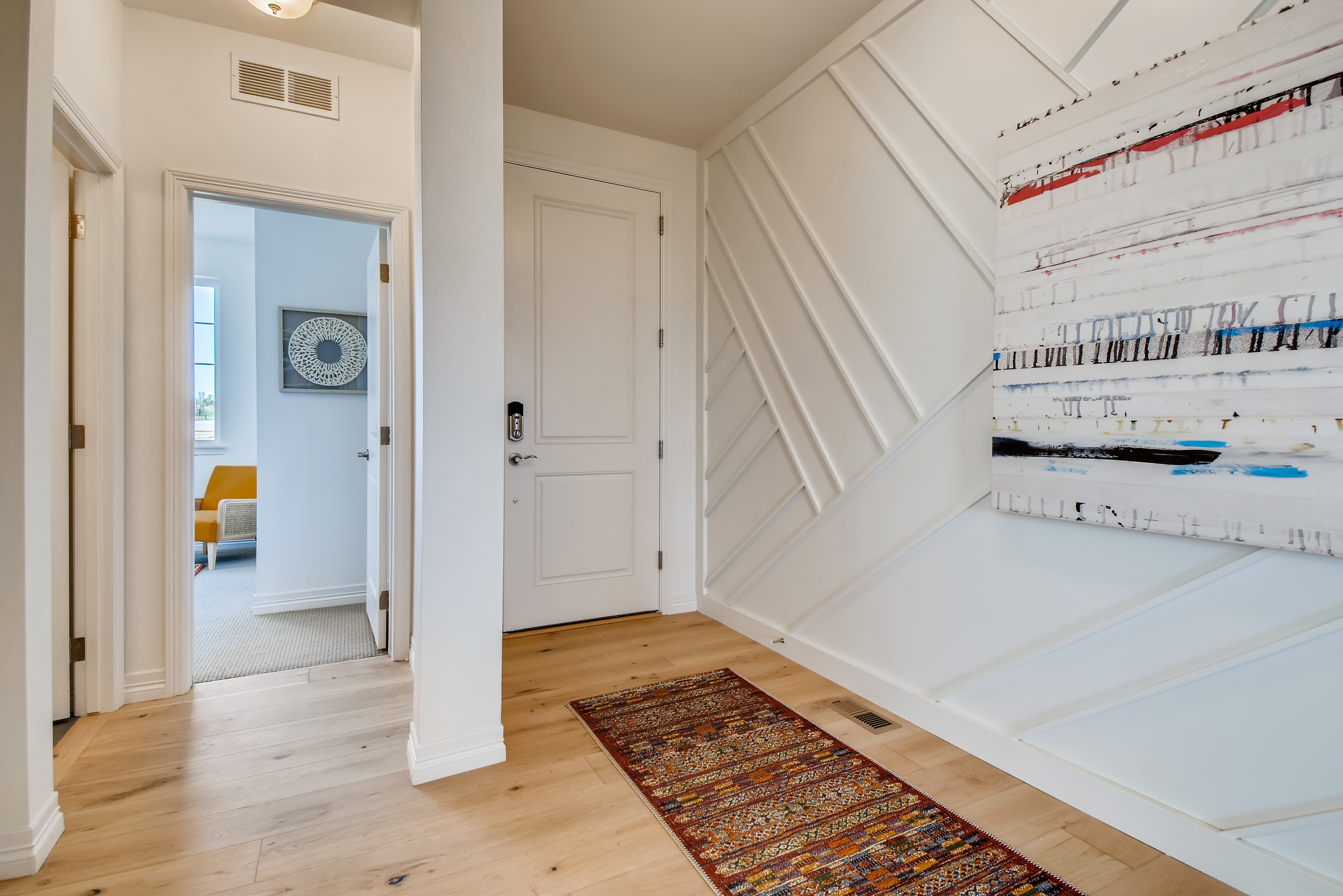A hallway with white walls.