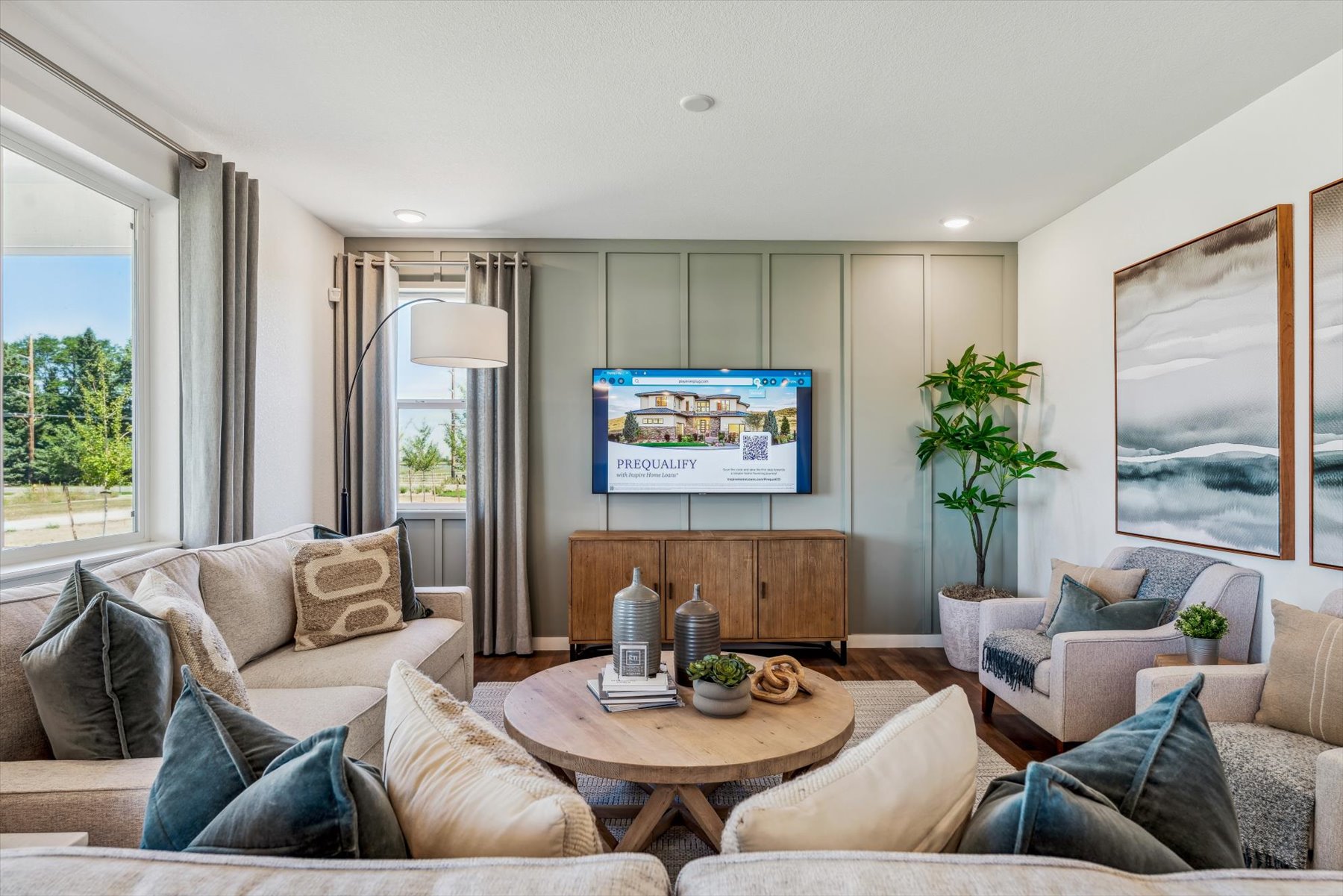 A living room with a tv and couches.