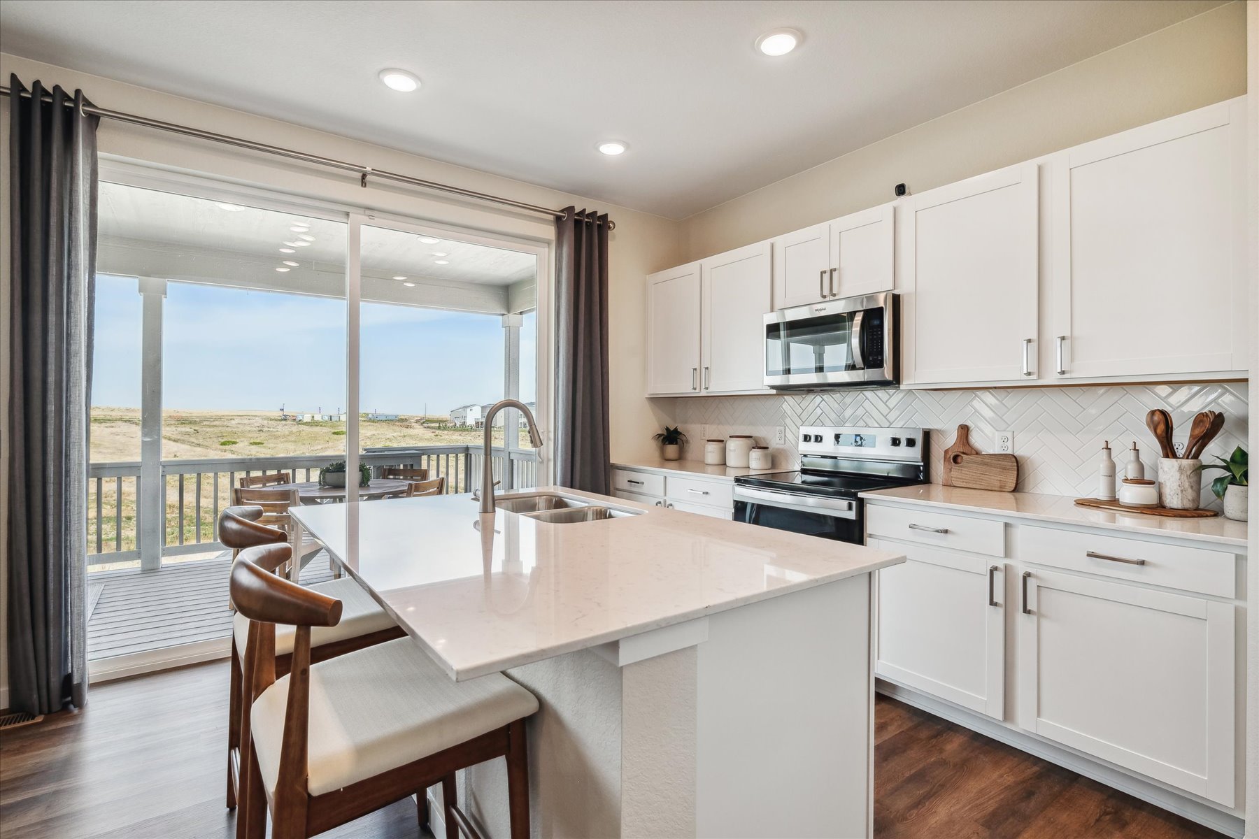 A kitchen with a large window.
