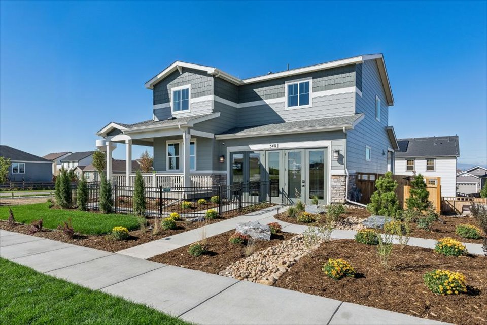 A house with a fence and a driveway.