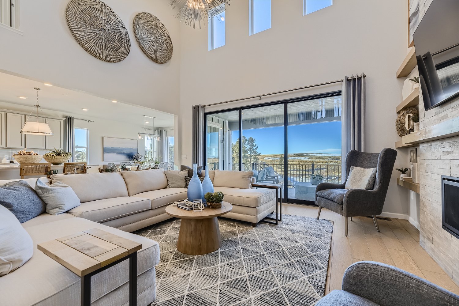 A living room with a large window.