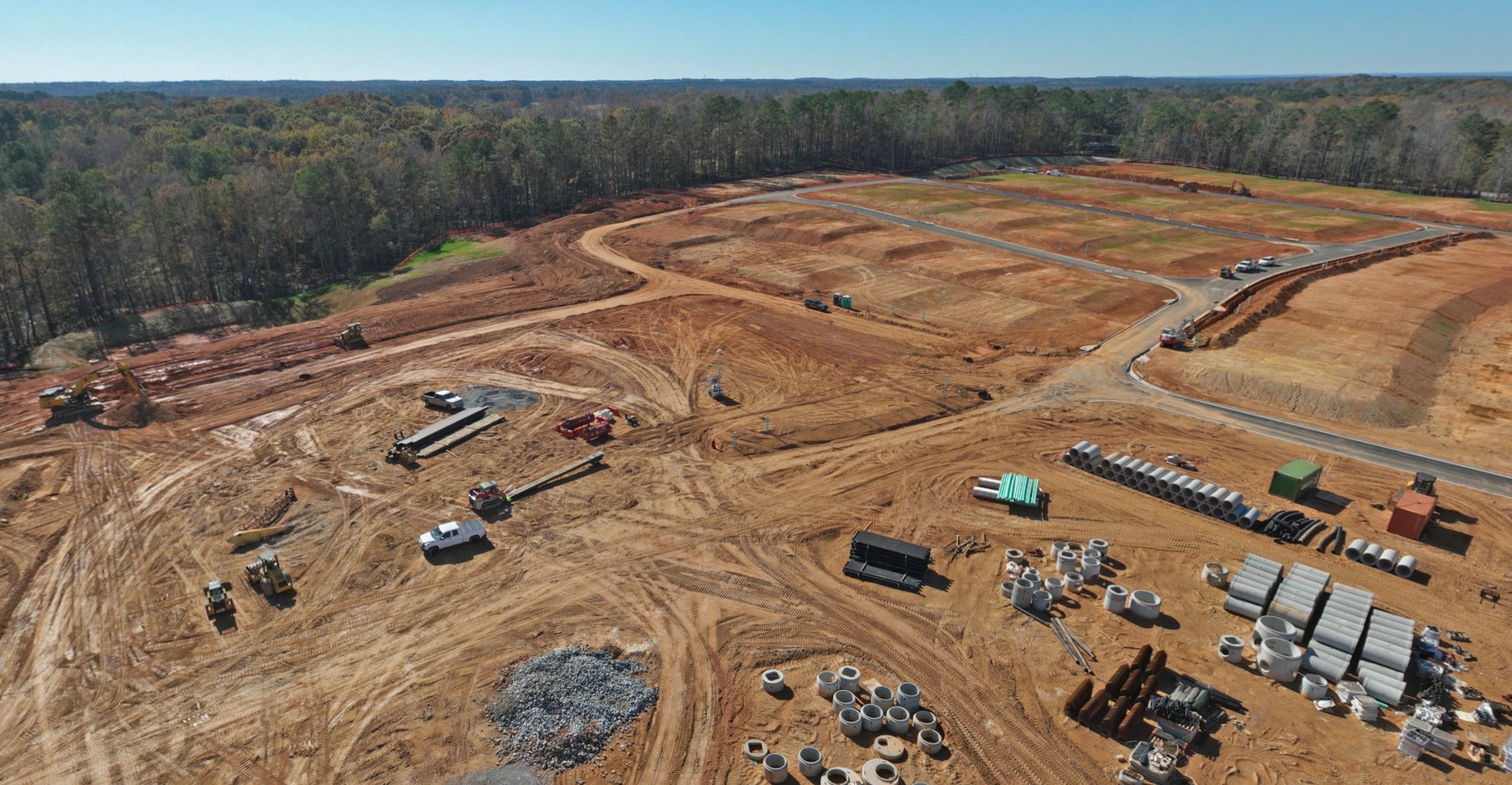 A large area with many cars and trees in the background.
