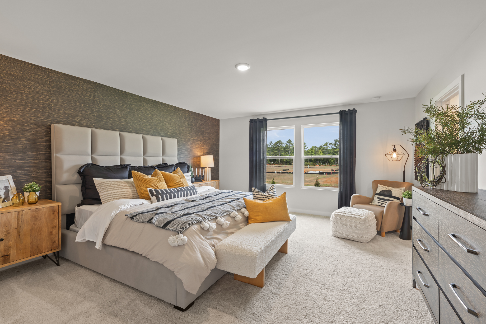 A bedroom with a bed and a couch.