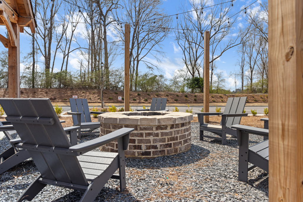 A group of chairs and a table outside.
