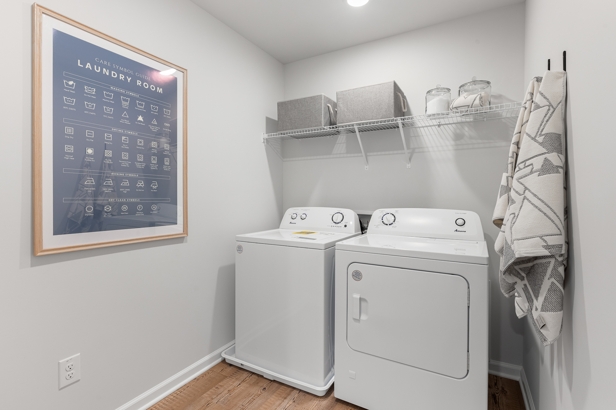 A laundry room with a chalkboard.