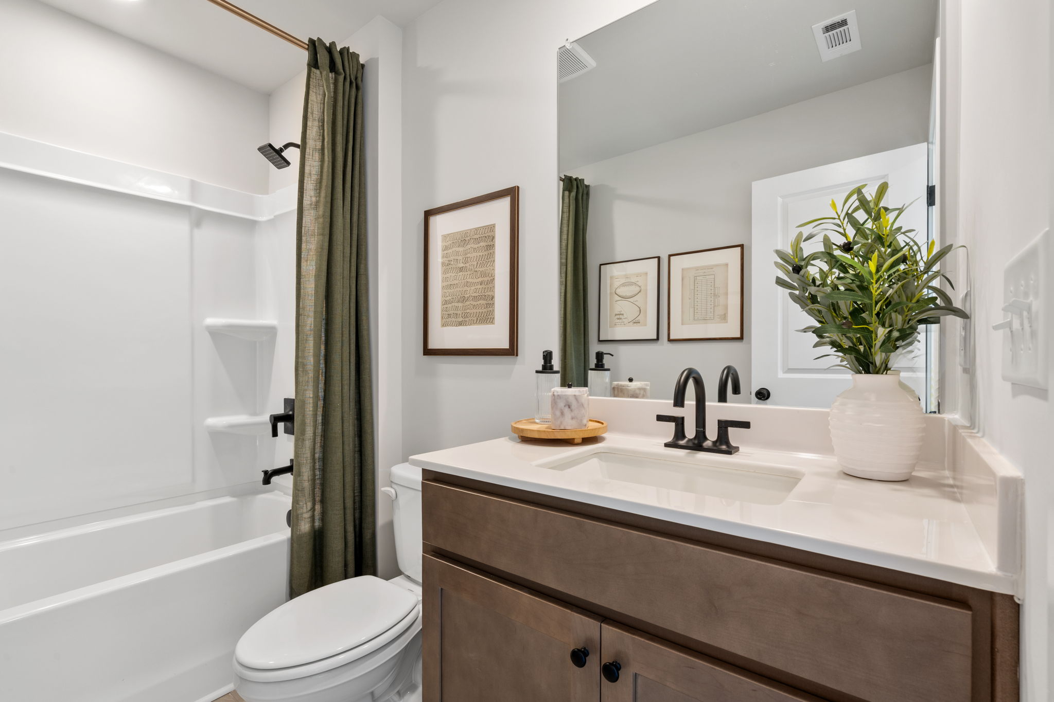 A bathroom with a sink and a toilet.
