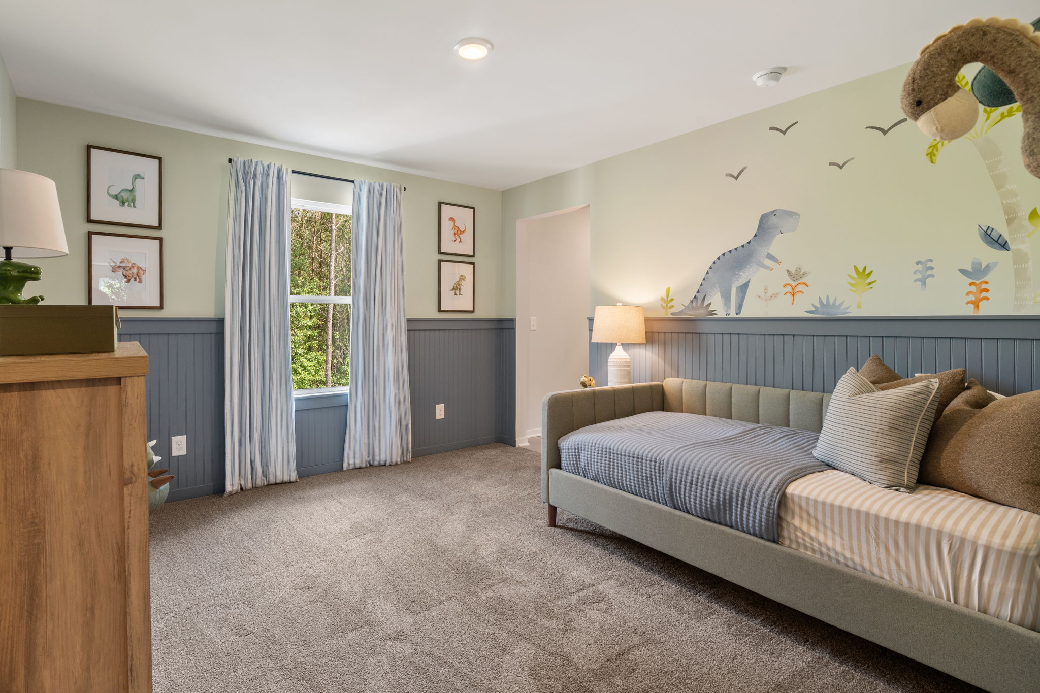 A bedroom with a bed and a couch.
