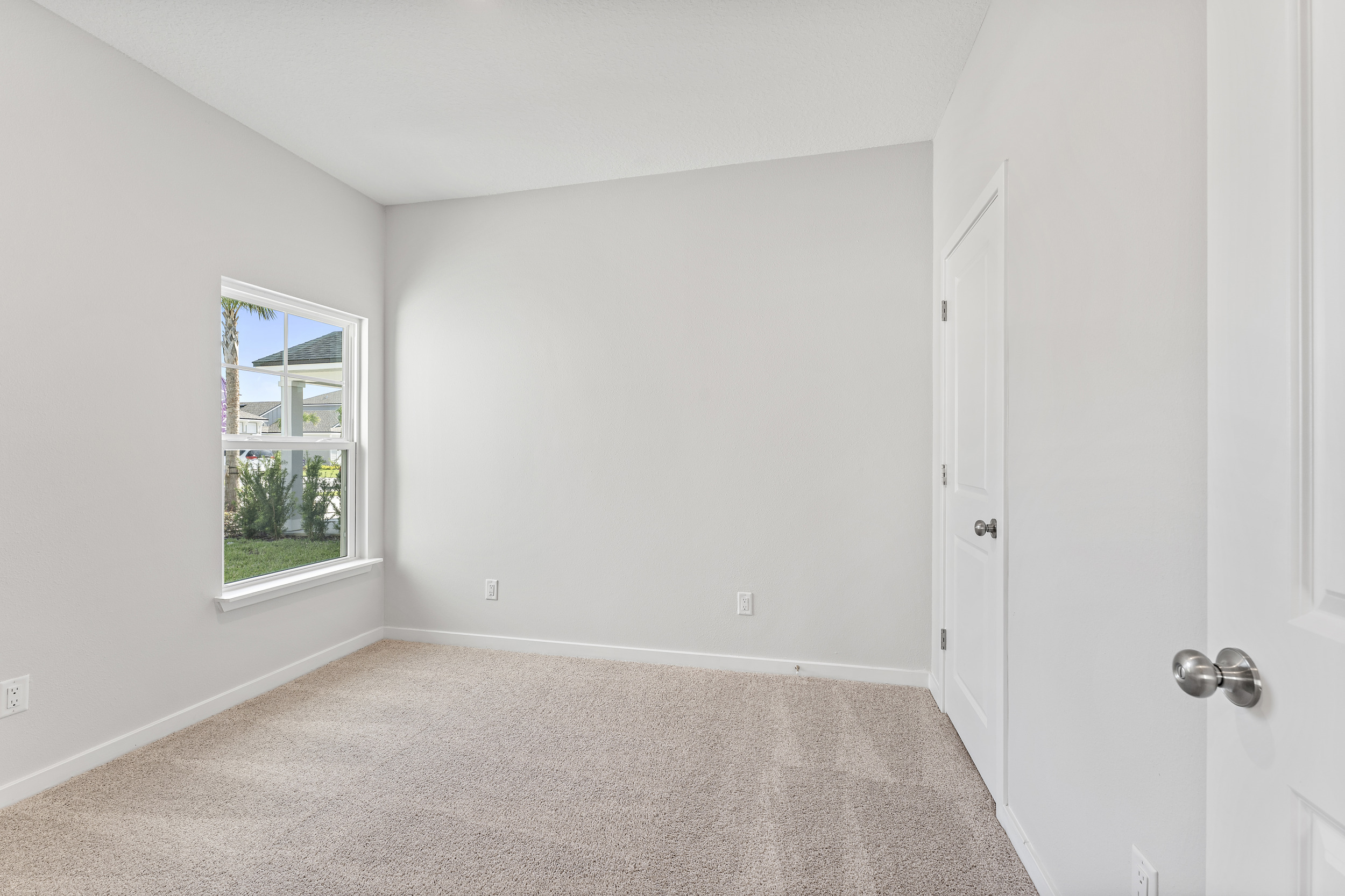 Lot 19 Cedar II Guest Room with Window Overlooking Front Yard at Camden Woods in Kingsland, GA