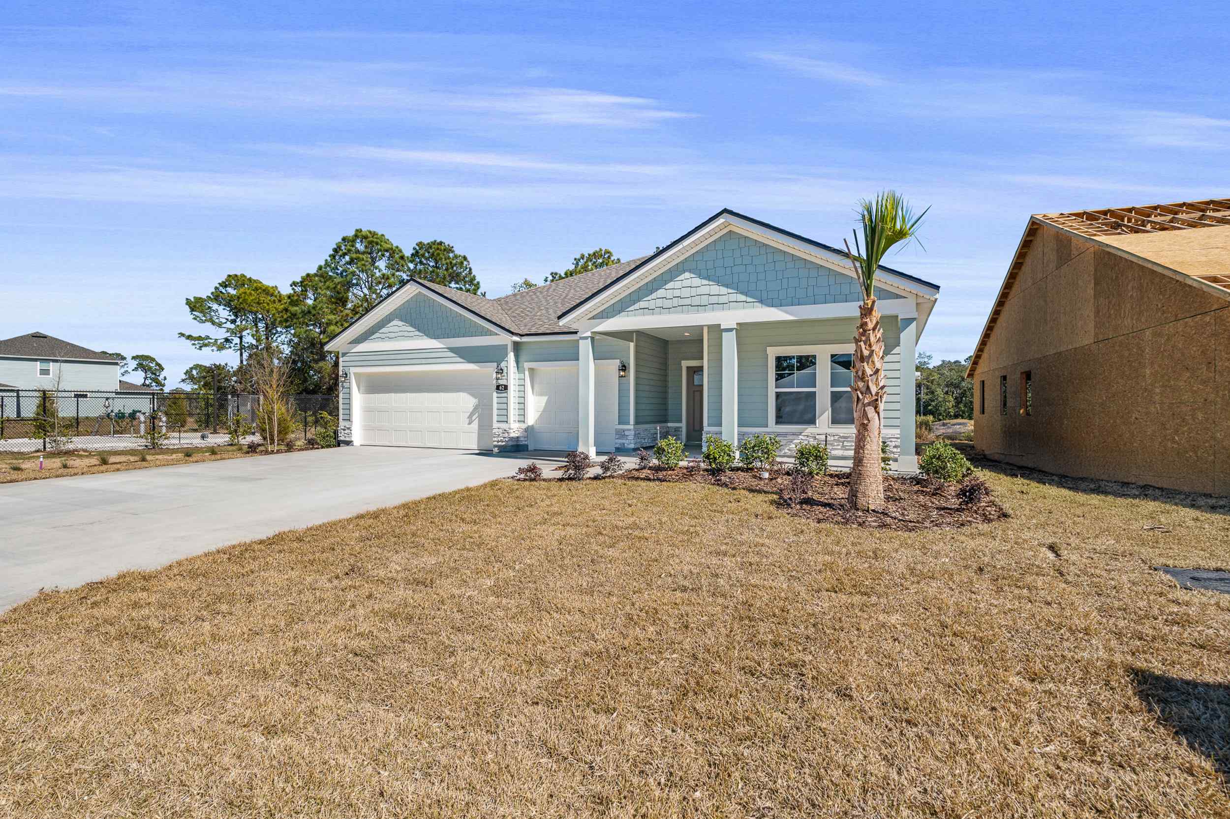A house with a lot of dirt in front of it.