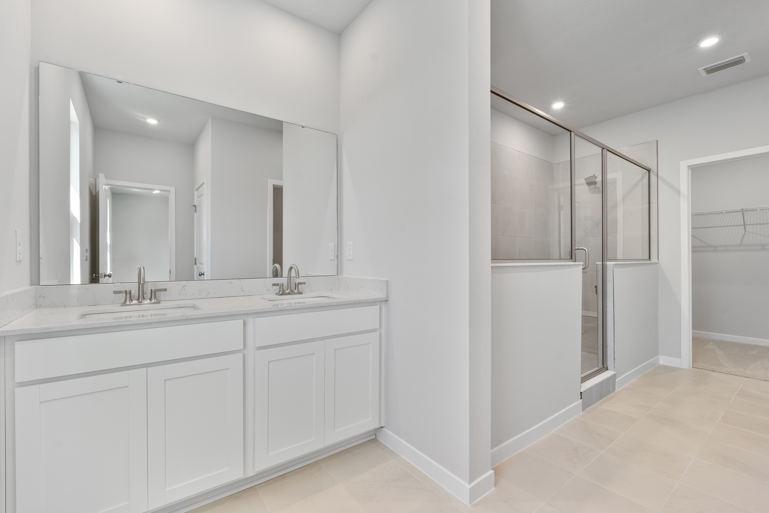 Lot 67 Primary Bathroom with Dual Vanity Sinks at Seminole Palms
