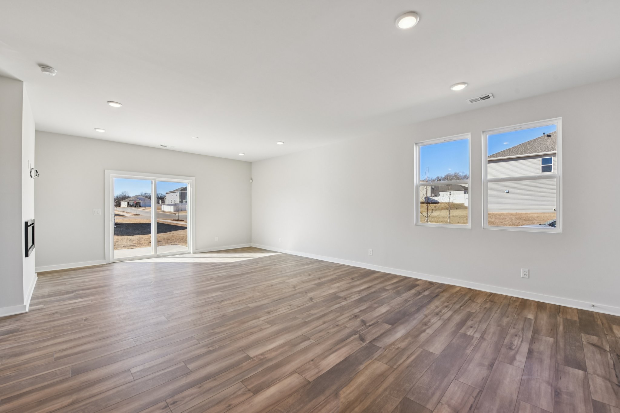 A room with a wood floor and a wood floor with a wood floor.