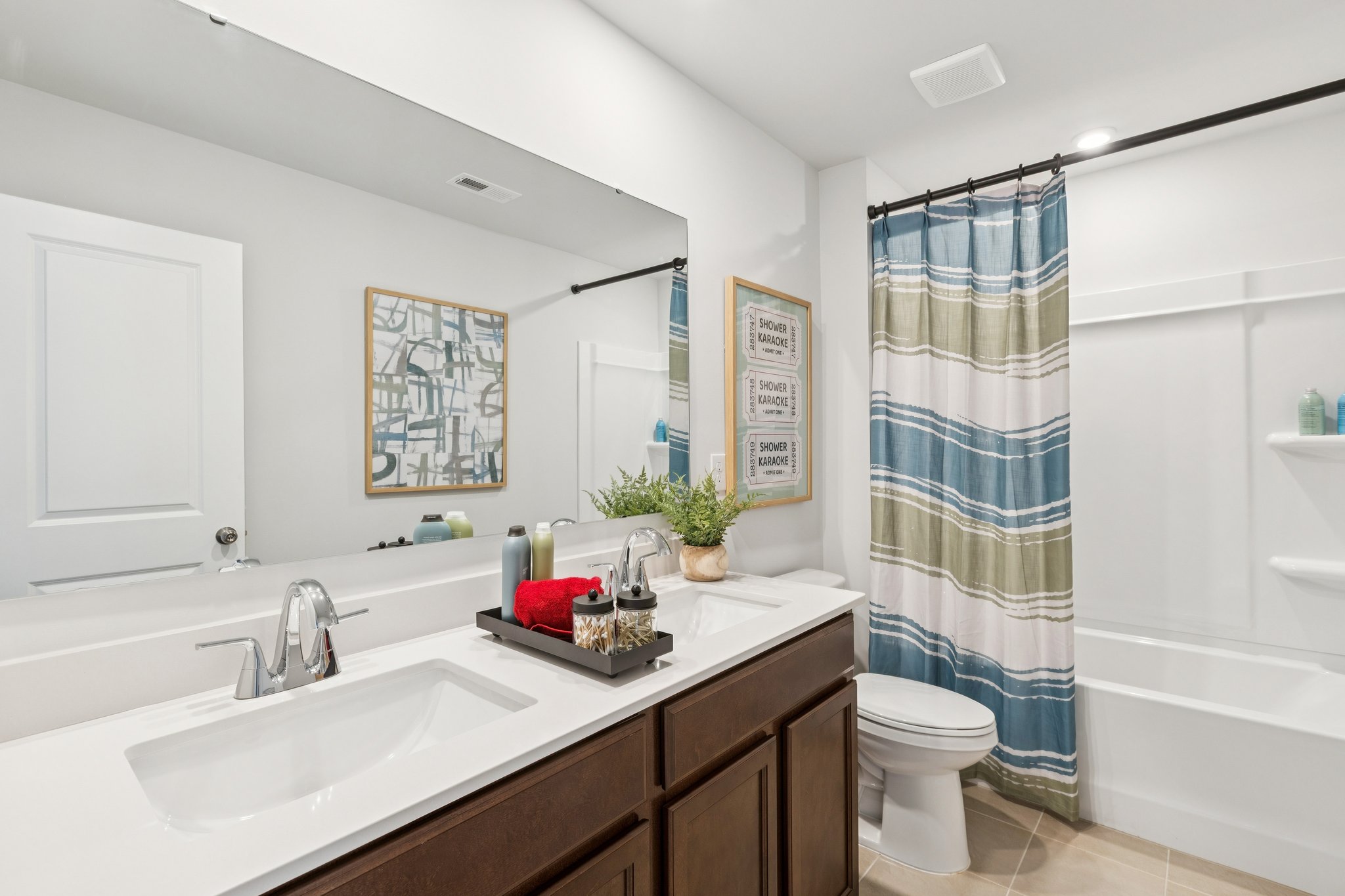 A bathroom with a tub sink and toilet.