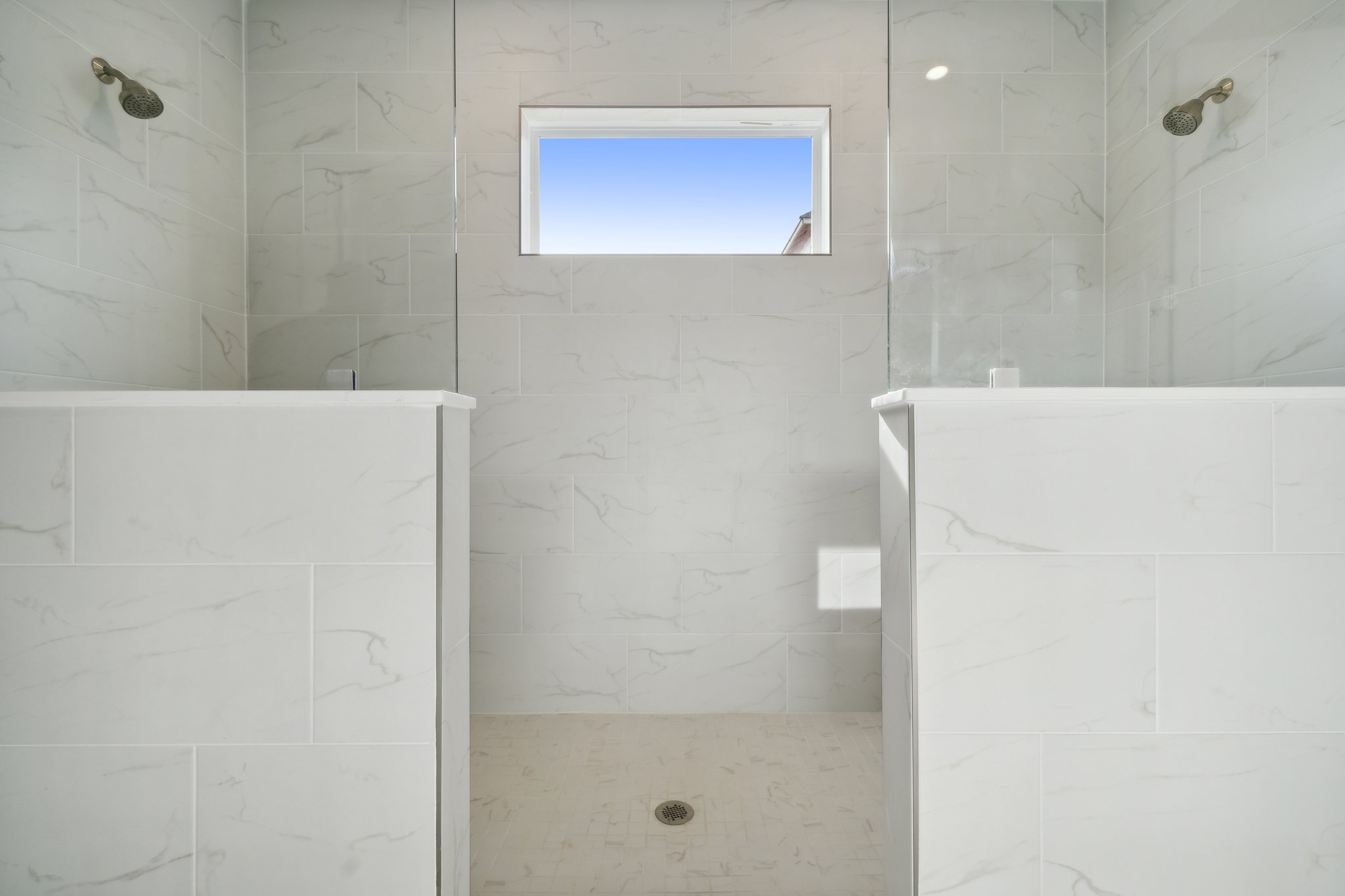 A bathroom with a window.