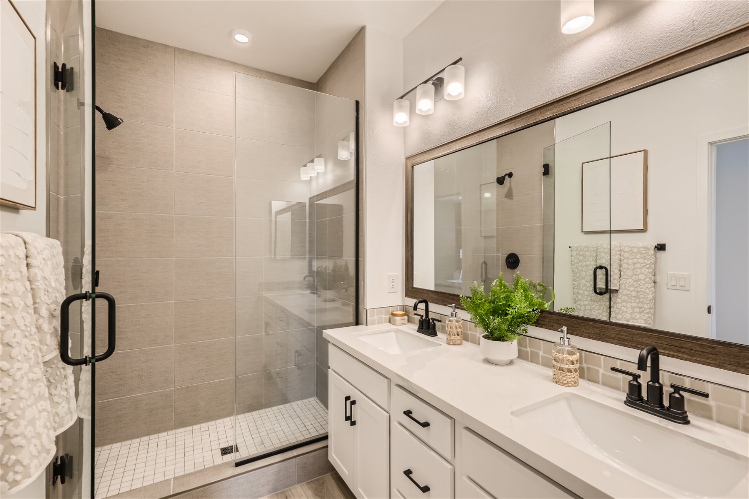 A bathroom with a glass shower.