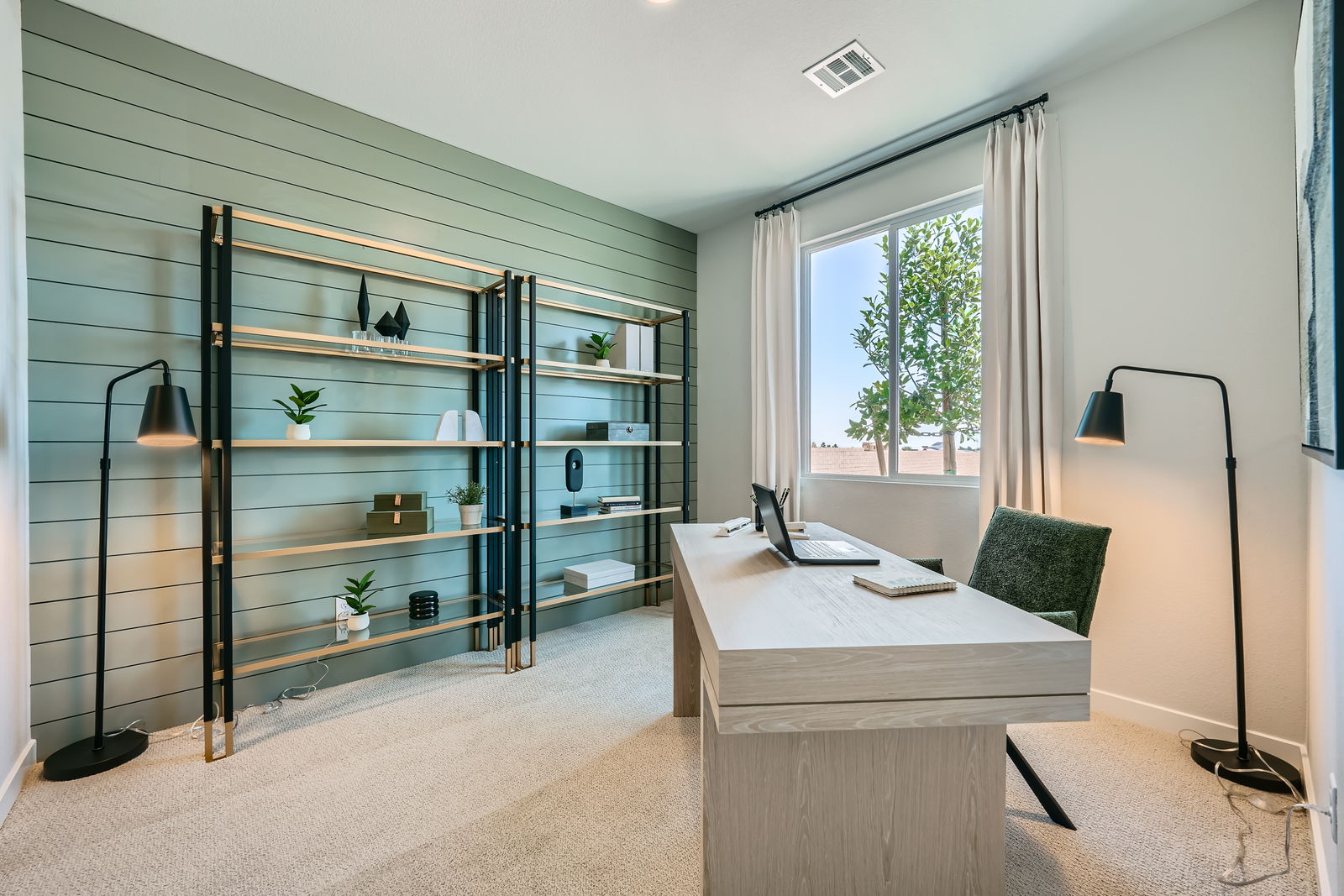 A room with a desk and a computer.