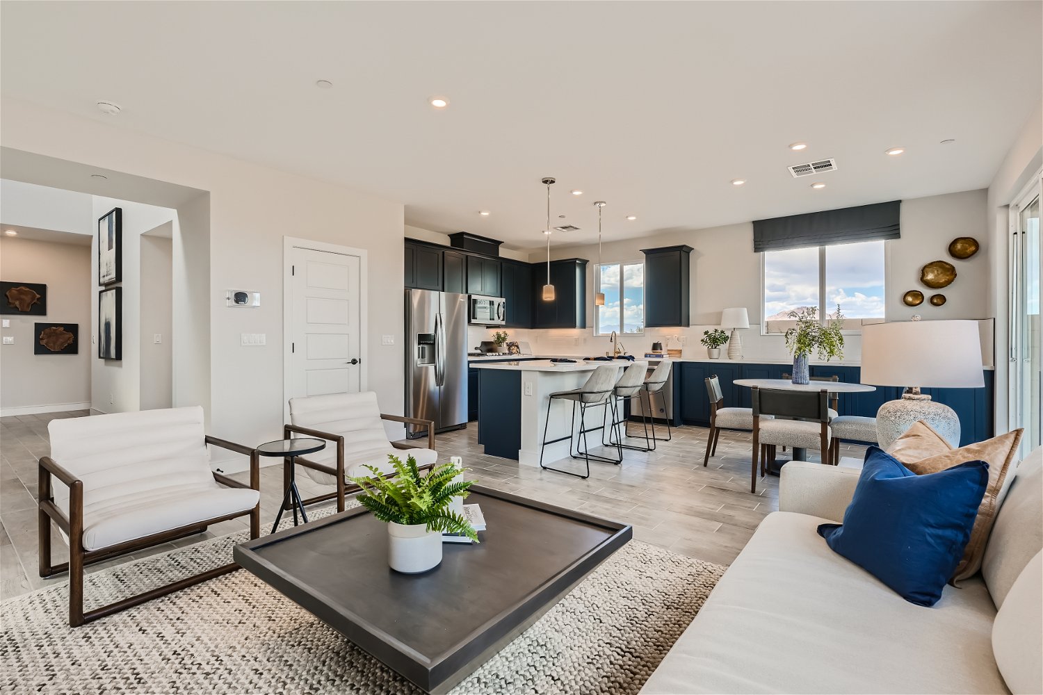A large living room with a large kitchen and dining area.