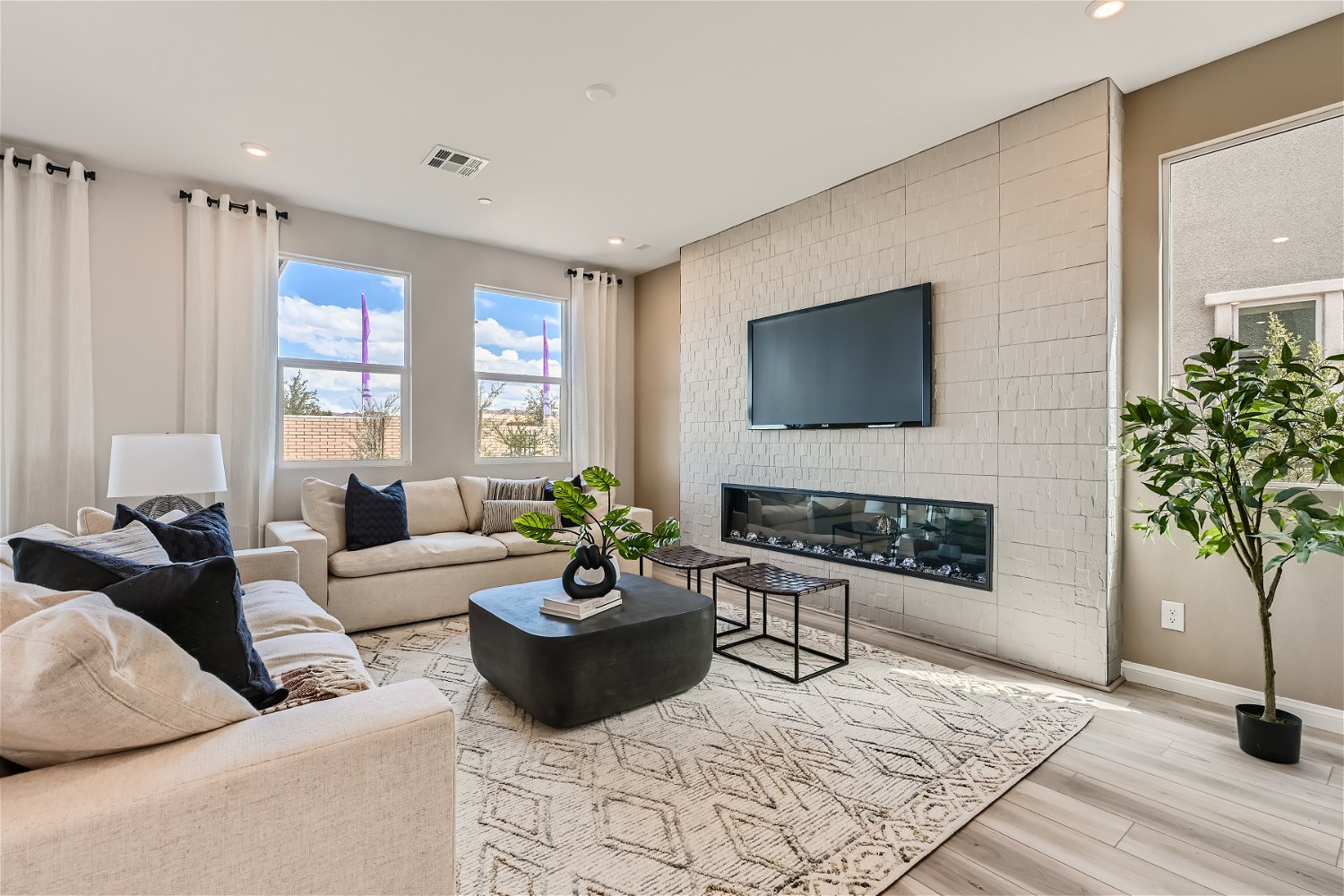 A living room with a fireplace.