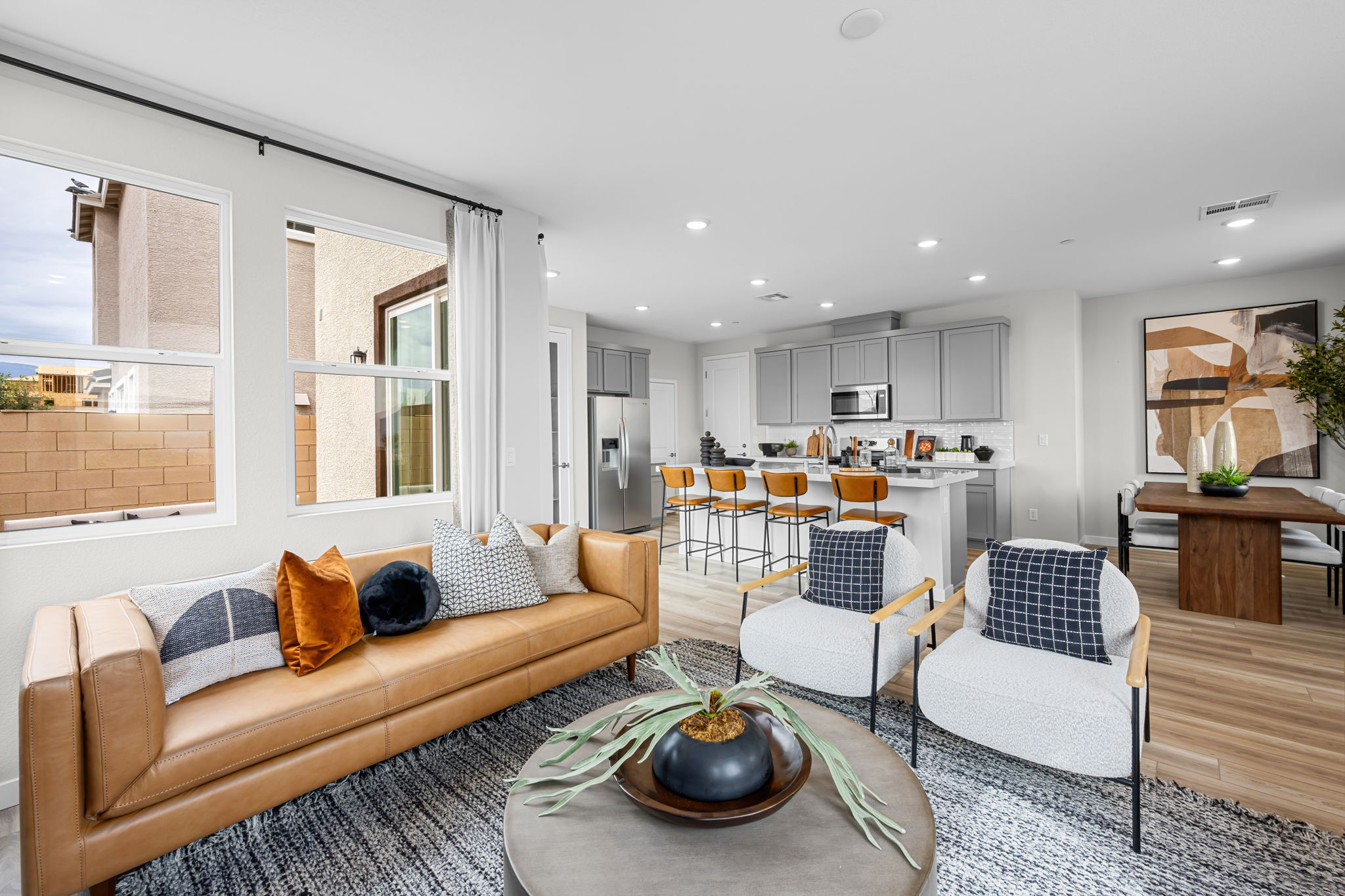 A living room with a couch and chairs.