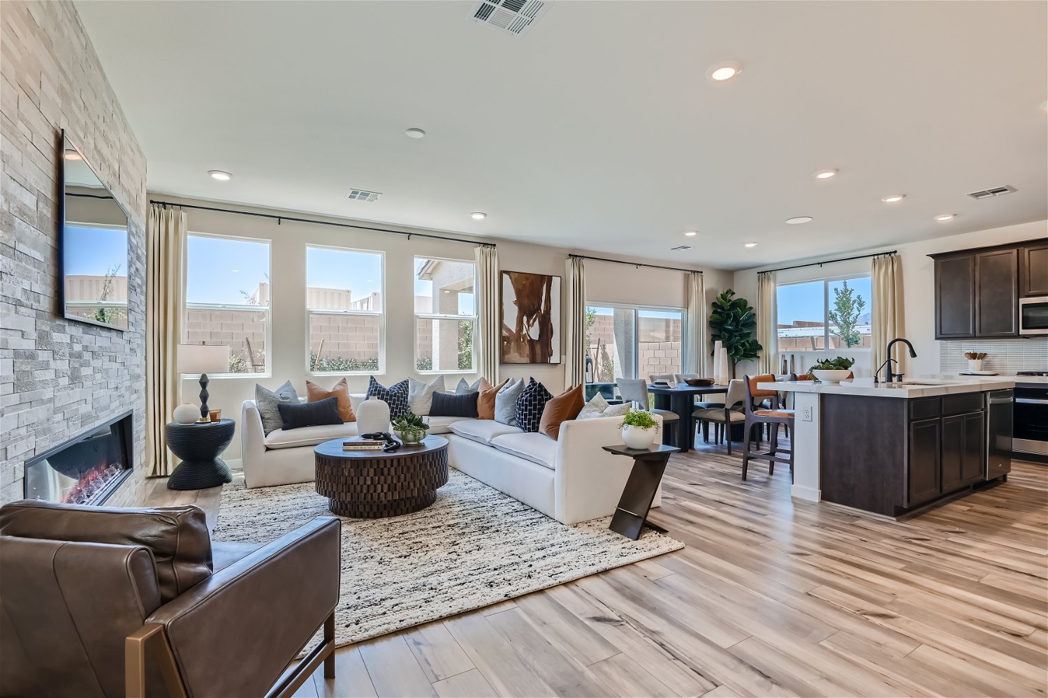 A large living room with a fireplace.