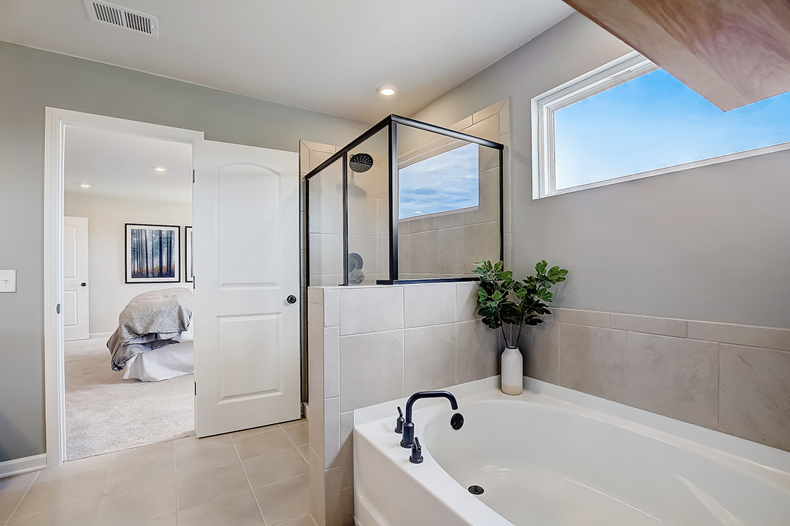 A bathroom with a tub and sink.