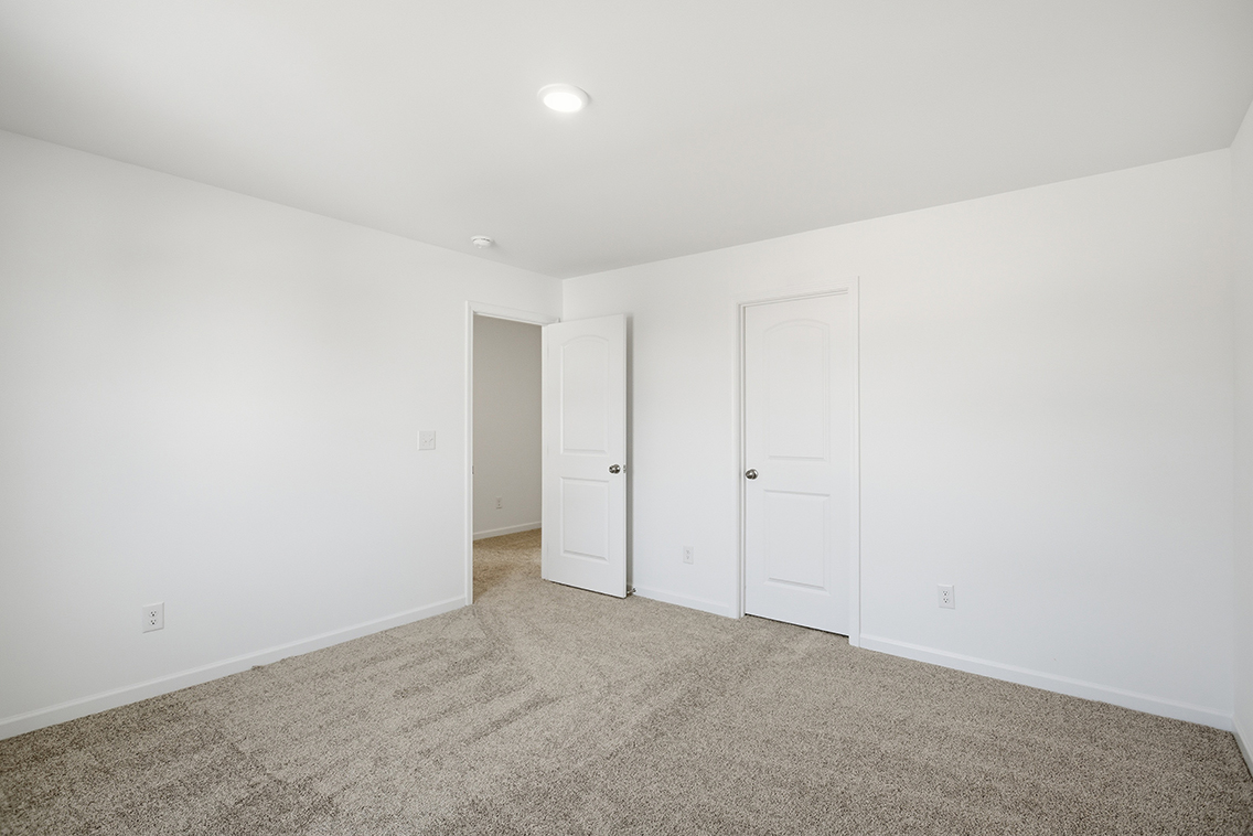 A room with white doors.