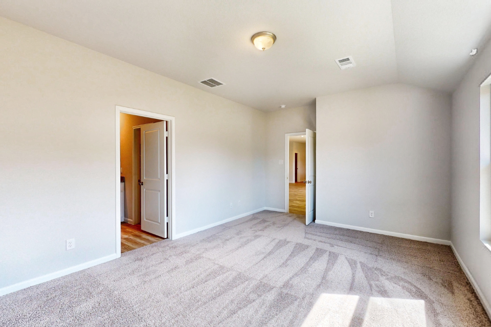 A hallway with white walls.
