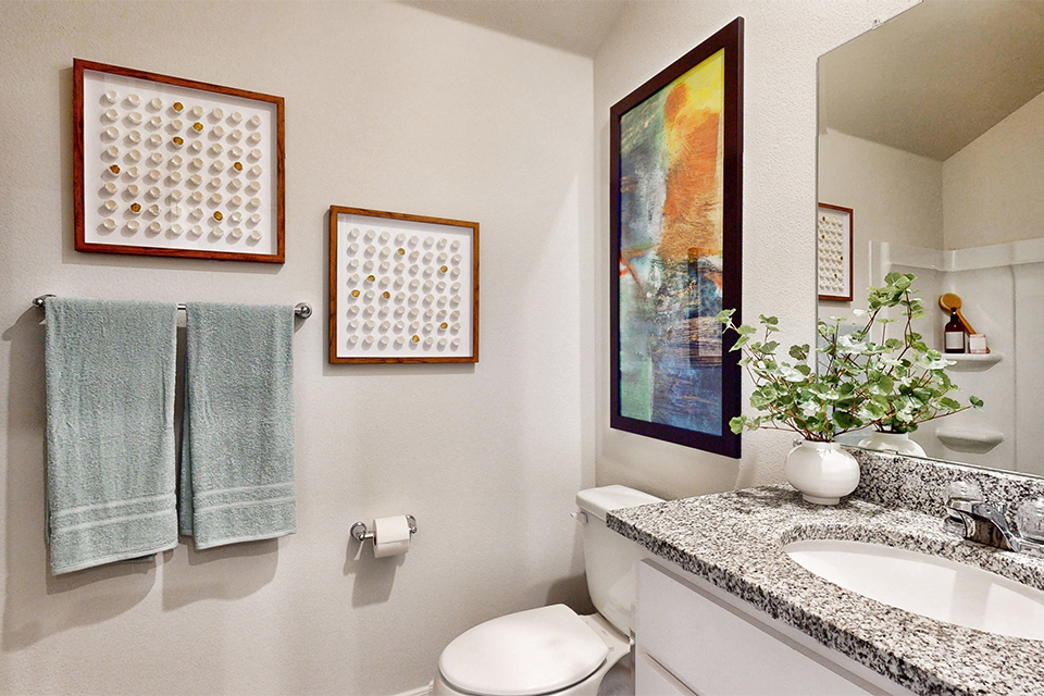 A bathroom with a sink and a toilet.