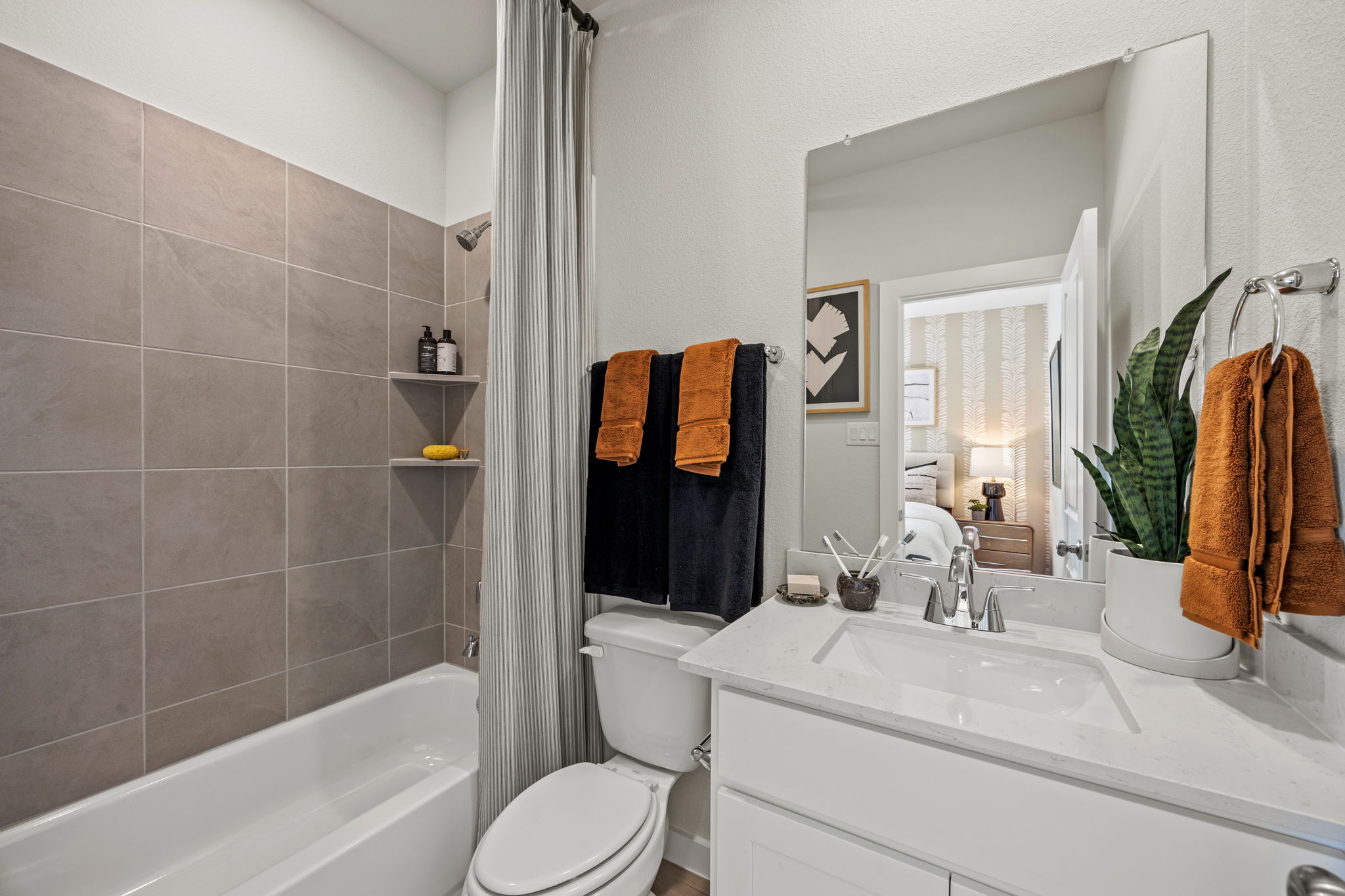 A bathroom with a tub toilet and sink.
