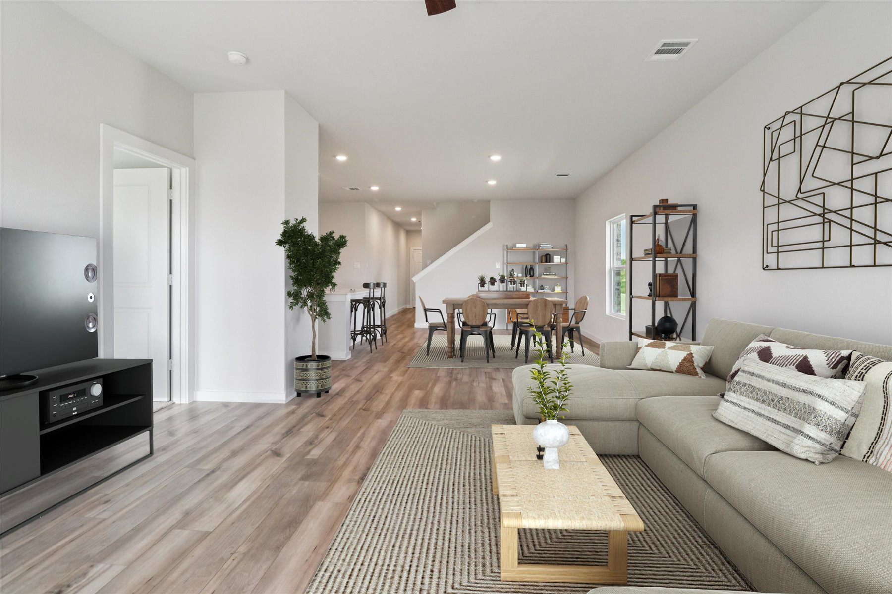 A living room with a wood floor.