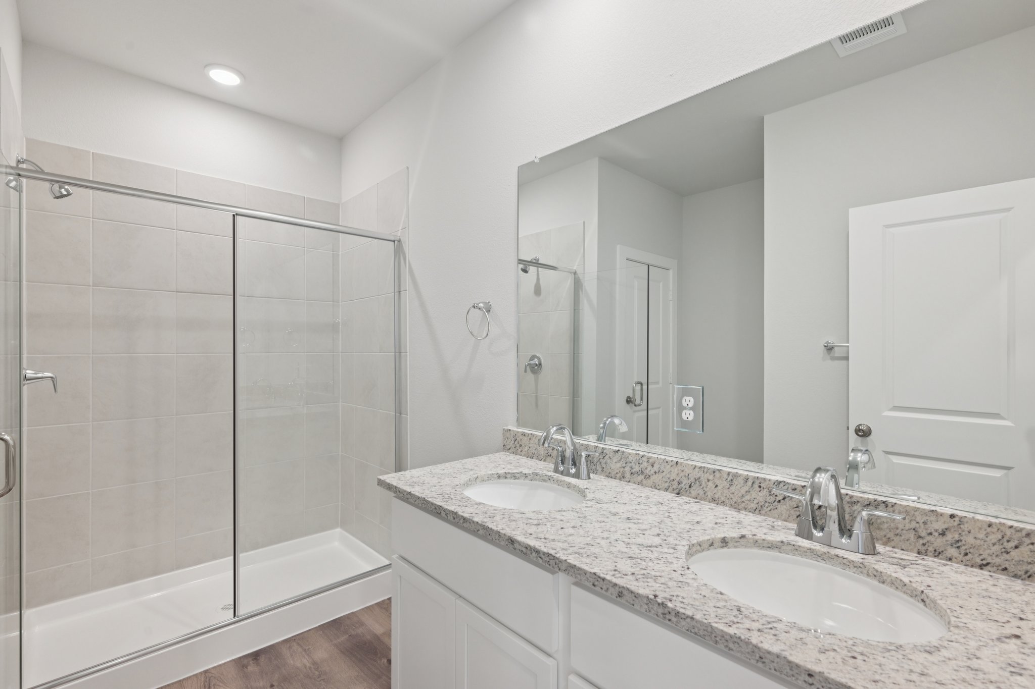 A bathroom with a glass shower.