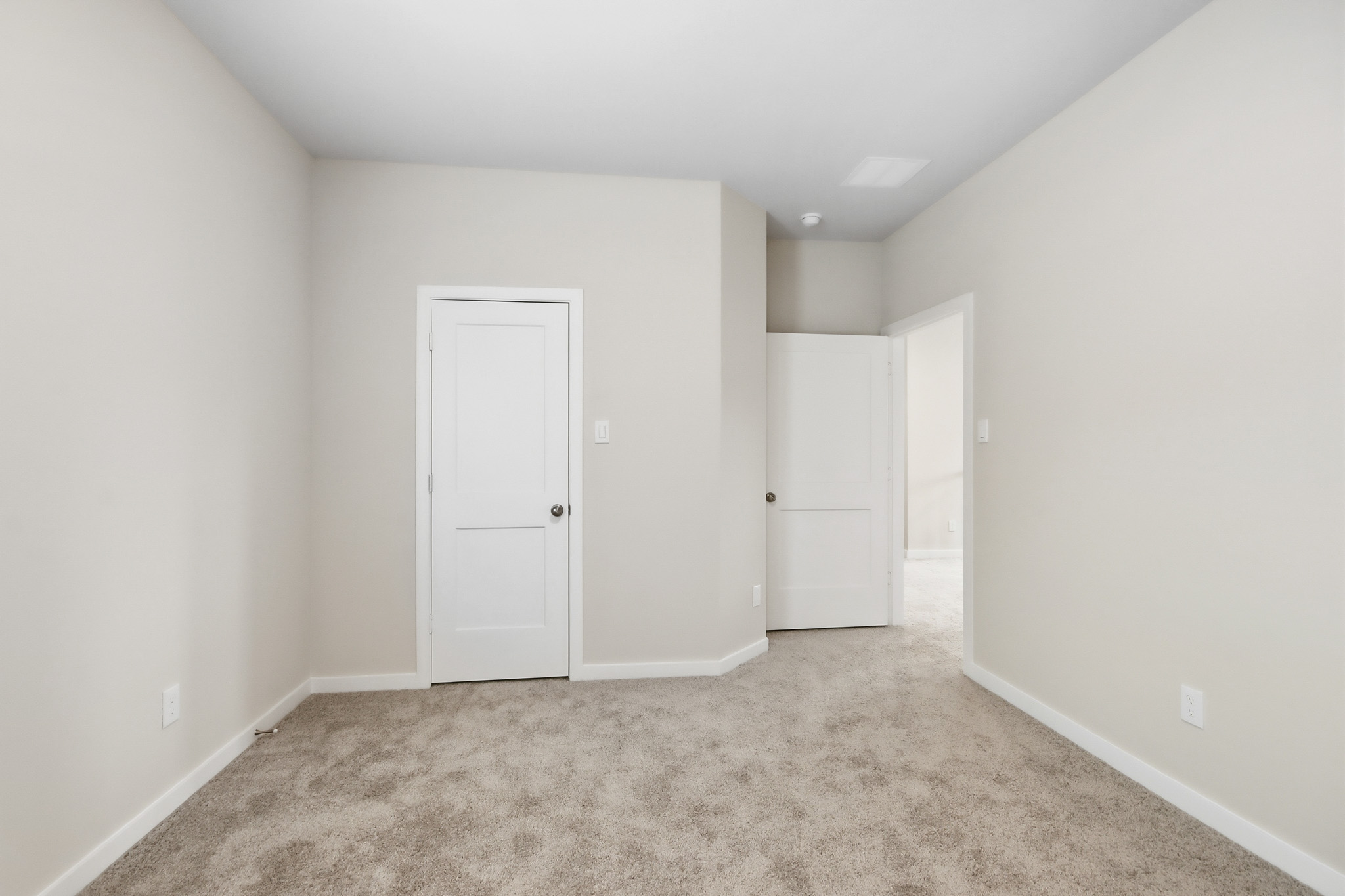 A room with white doors.
