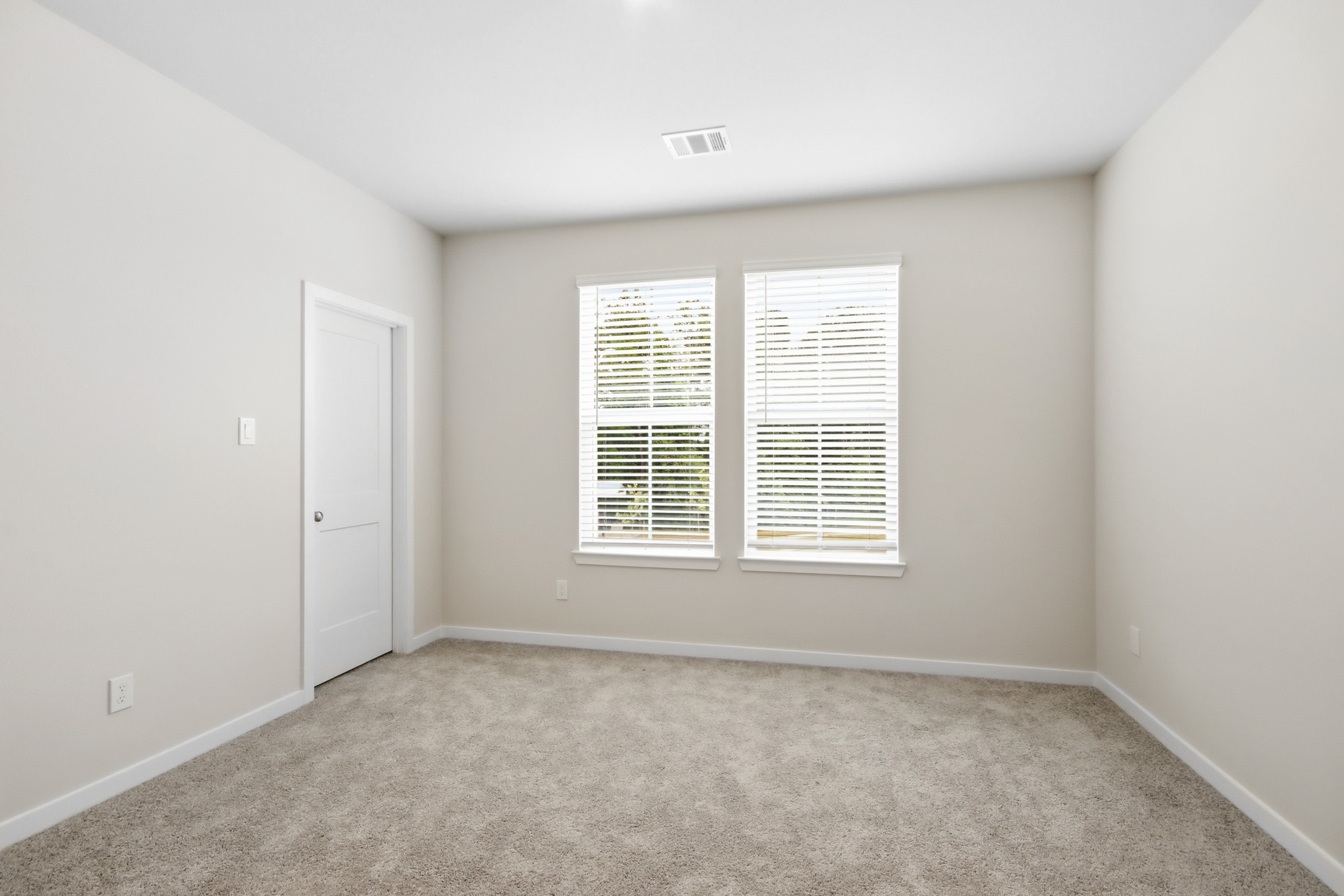 A room with a door and a window.