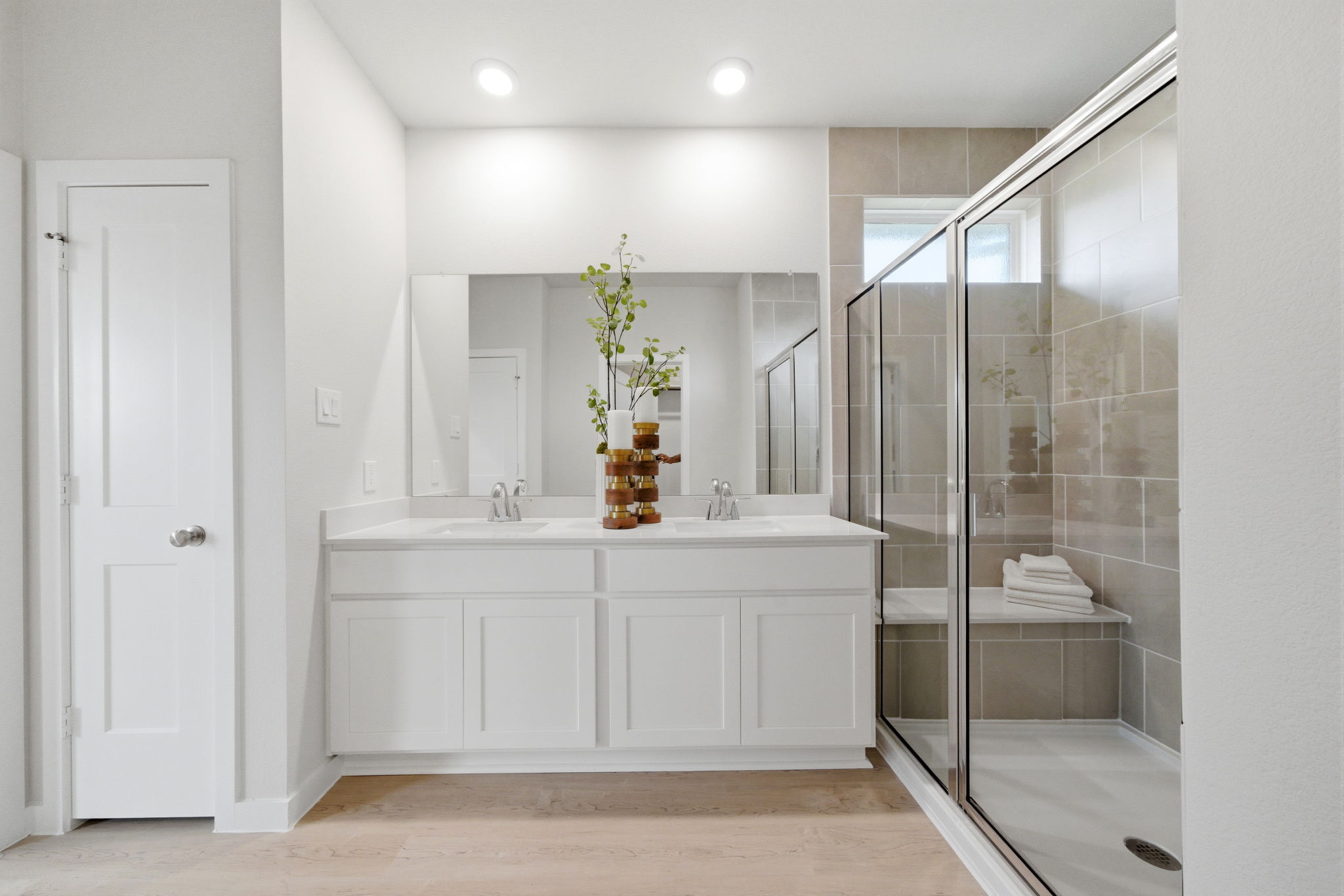 A bathroom with a glass shower.