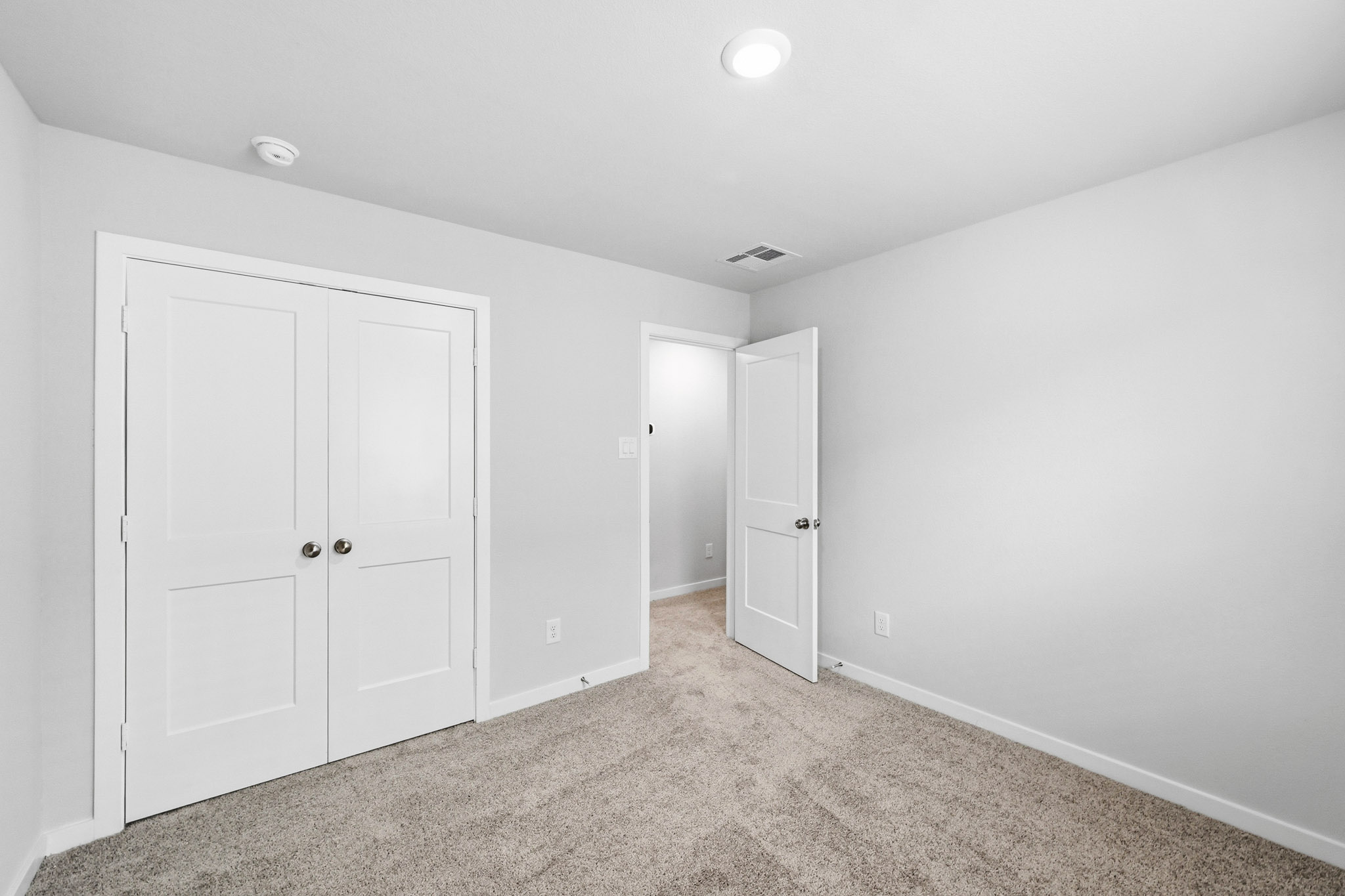 A room with white doors.