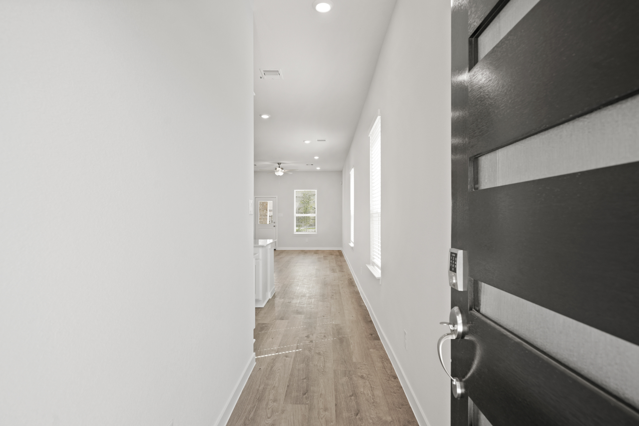 A hallway with white walls.