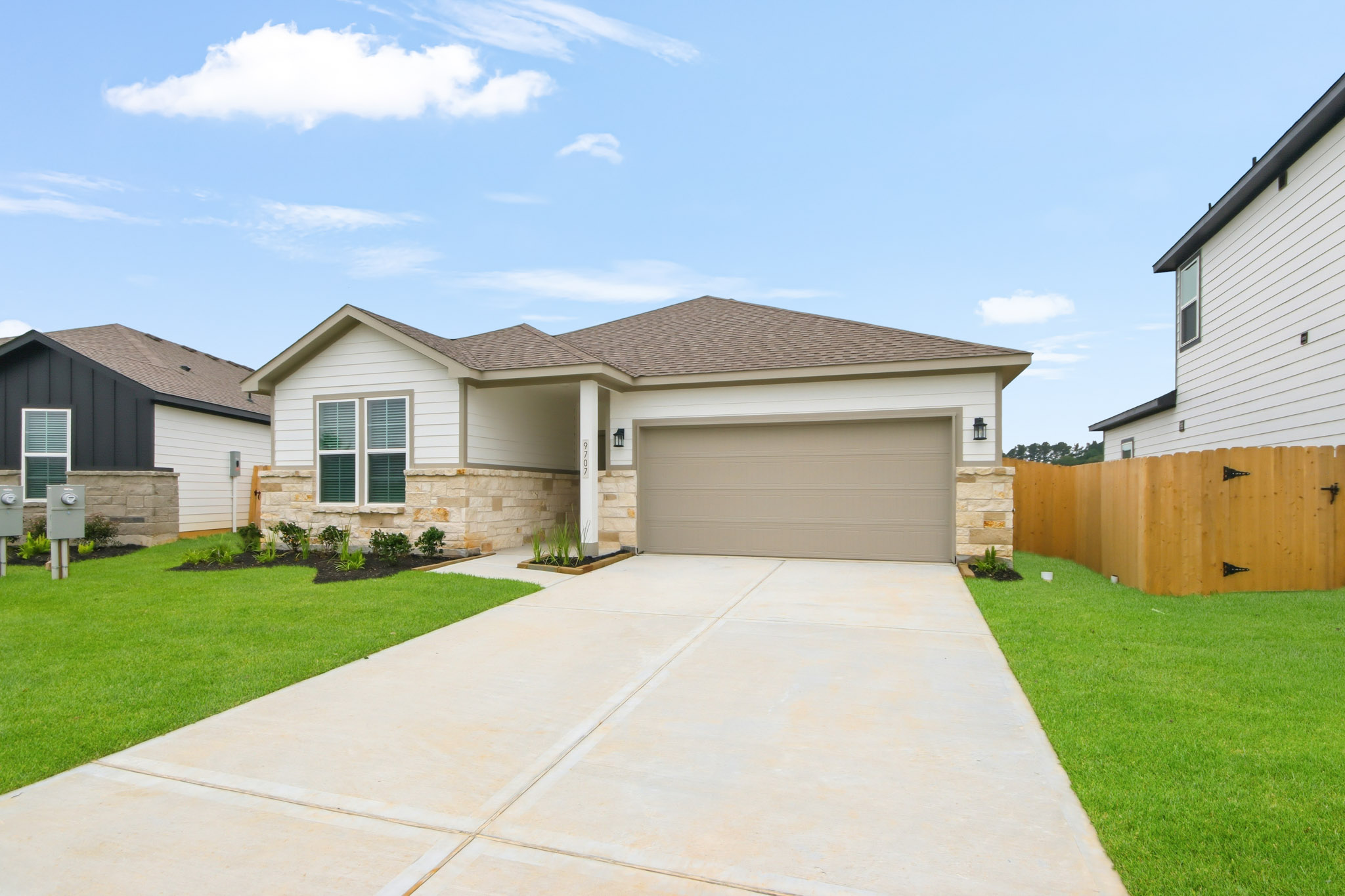 A driveway leading to a house.
