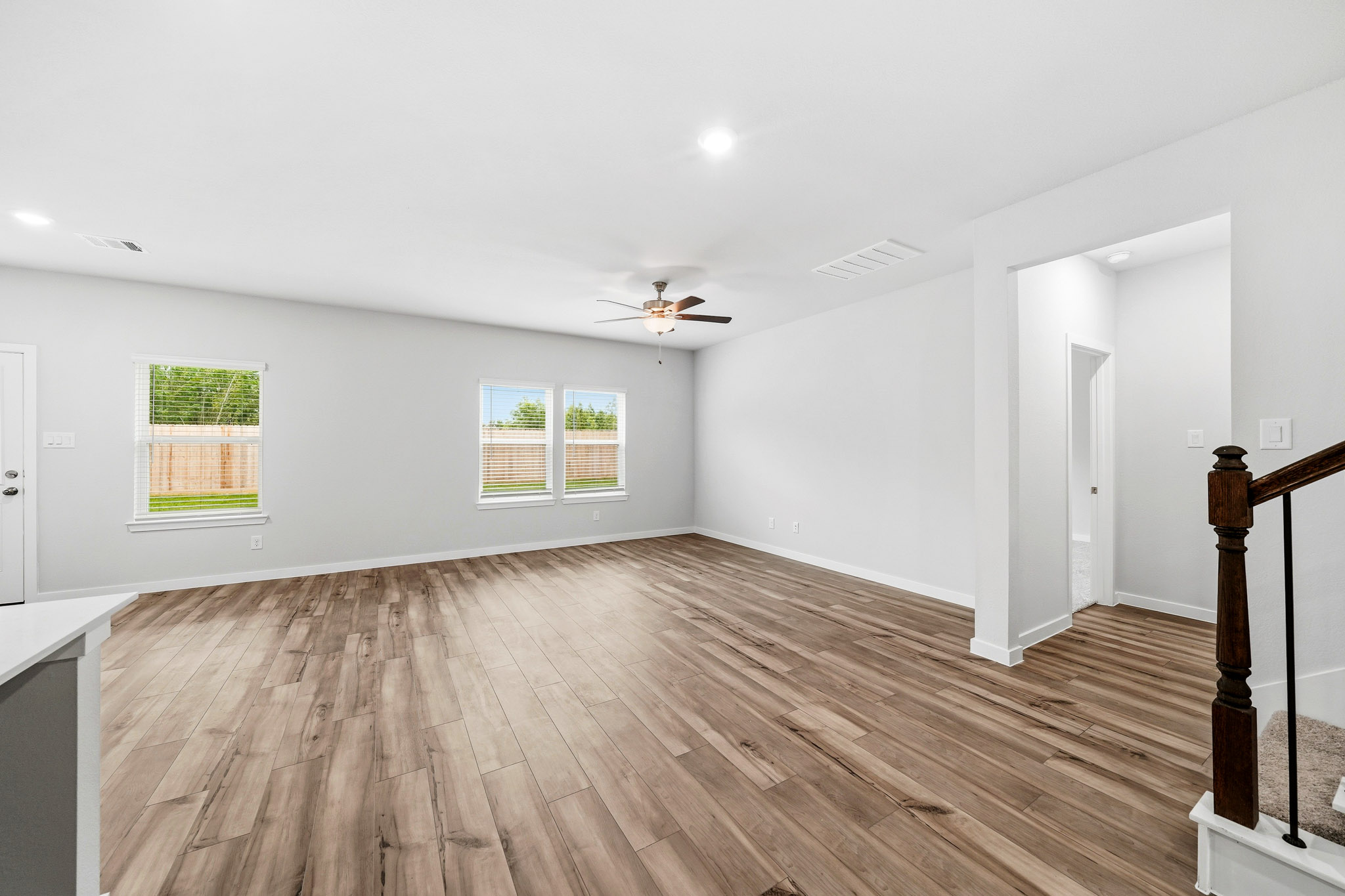 A room with a wood floor and a wood floor with a wood floor.