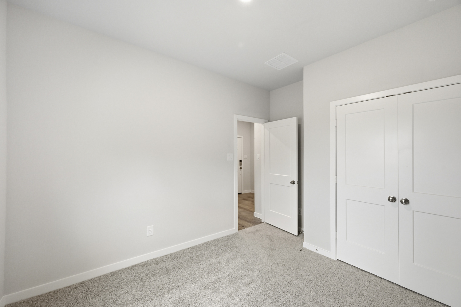A room with white doors.