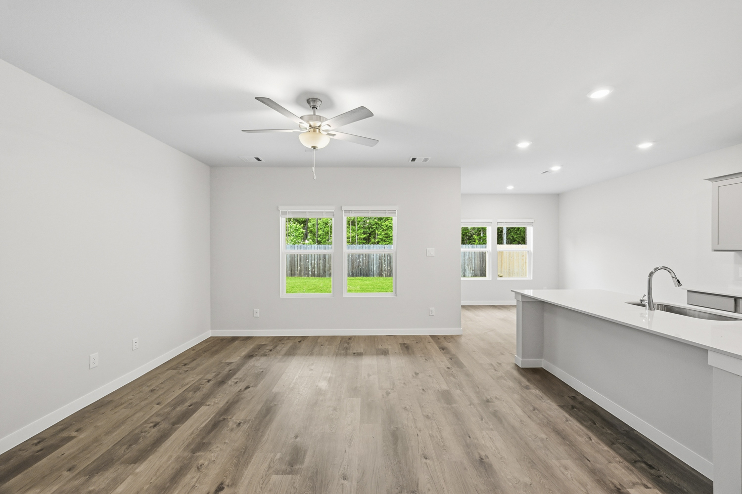 A kitchen with a wood floor.