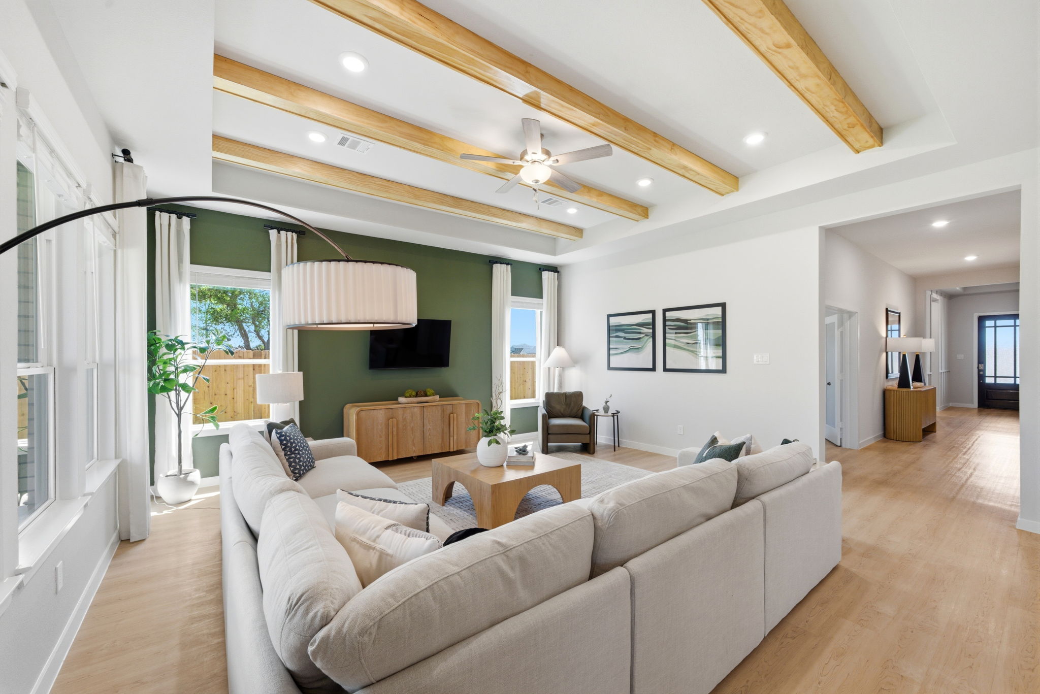 A living room with a large mirror.